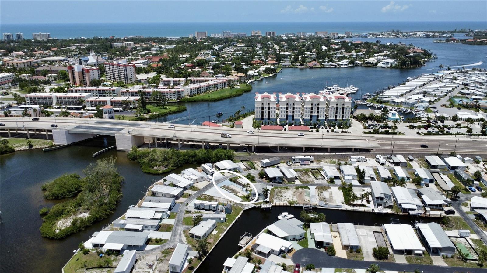 Fantastic lot for sale in Venice Bay Park where you own the lot! Just minutes from Historic Downtown Venice and Gulf Coast Beaches. This vacant lot is ready for you to pick and install a new elevated manufactured home. Great location just across from marker 4 and dockside grill. Head over the north bridge to downtown Venice with shopping, dining and events. Easy access to the wonderful legacy trail. Venice Bay Park is a 55 plus community with low fees. Grass cutting, and water/sewer included. Come and see this lot today!