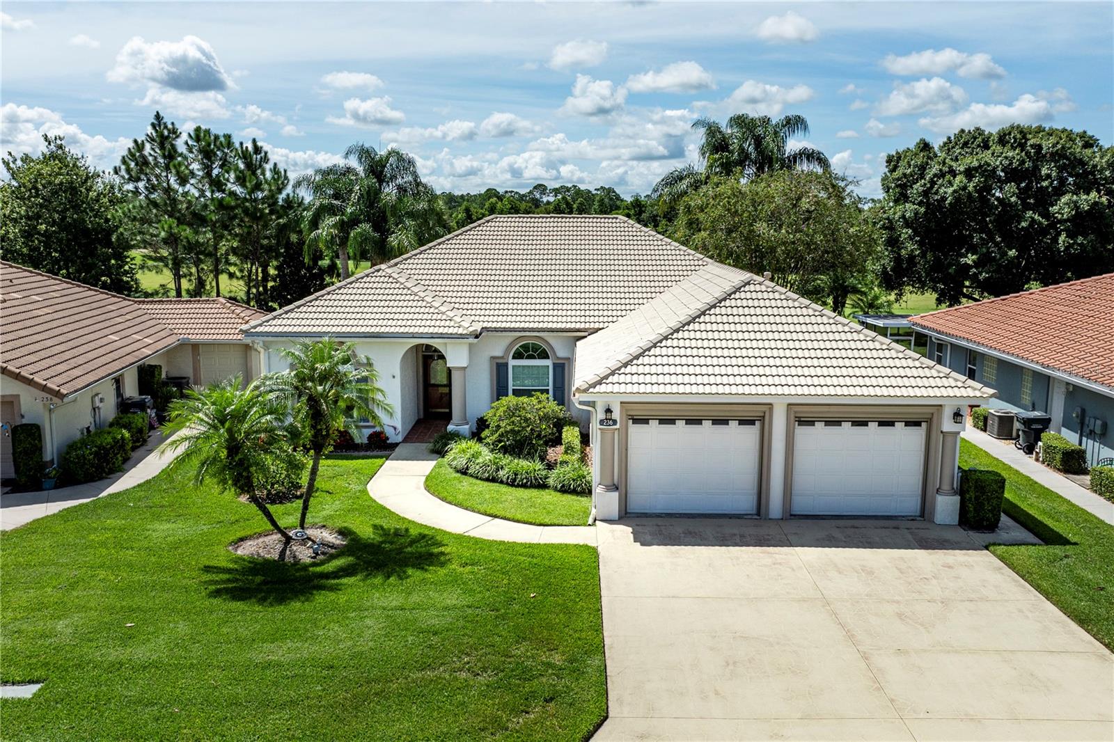 One or more photo(s) has been virtually staged. Welcome to 236 Golf Aire Blvd, a beautiful home in the gated Lake Bess Country Club community, perfectly situated on fairway number one. This spacious home features 3 bedrooms, 2 full bathrooms, an oversized 2-car garage, and spans 2523 square feet. As you approach, you'll appreciate the serene setting, meticulously manicured lawn, and ample driveway space. For your peace of mind, the home also includes a Generac Whole House Generator. Upon entering, you are greeted by a bright and open living space. The living room boasts high ceilings, elegant wood flooring, and generous wall space for your decor. The formal dining room offers versatile options, whether you use it for meals, a home office, or a peaceful reading nook. The kitchen is a chef's delight, with abundant real wood cabinetry, ample counter space for meal preparation, stainless steel appliances, and plenty of room for entertaining friends and family. The convenient inside laundry room is located just off the kitchen and close to the primary suite. You'll adore the additional family room, which provides a stunning view of the fairway with no rear neighbors, abundant natural light, and space for another sitting area or a game room. The primary suite is a true retreat, featuring high tray ceilings, double closets, natural lighting, and a luxurious en-suite bathroom. Off of the Primary bedroom is a separate full nursery, office, craft room, etc. along with the half bathroom. The primary bathroom offers a relaxing garden tub, a stand-up tiled shower, and dual sinks. The additional bedrooms each offer high ceilings, comfortable carpeted floors, and built-in closets. The Lake Bess Country Club has a lot to offer for the low monthly fee. Your amenities include your lawn maintenance and shrub trimming, a 2-person Gold Golf Membership allowing access to all the golf you want to play, golf course, driving range, putting green, clubhouse swimming pool and the non-guarded gated community. Please note no rentals are allowed. All information recorded in the MLS is intended to be accurate however, it should be independently verified by buyer and their agent.