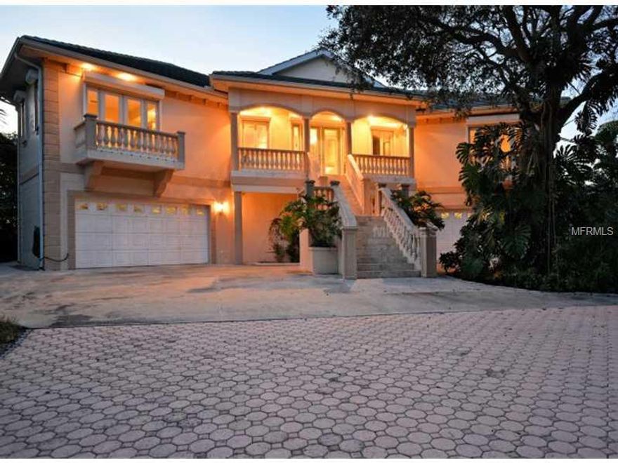 If you are seeking a home built like a fortress with loads of living directly on the gulf, do not miss this. The home has been constructed on 51 concrete pilings and is extremely solid from the interior to the exterior with minimal maintenance in mind. The main living floor encompasses four bedrooms and four full baths with 4,885 square feet.  There is additional living under A/C which could be used for guests, in-laws, movie theater, rec-room, fitness equipment, storage or just about anything. Total A/C square footage is approximately 7,000 sq. ft. This house is top-quality with granite, high-end appliances, custom millwork, travertine floors, lightning protection, elevator, Pella windows and doors, electric hurricane shutters, epay wood constructed decks and much more. The lower level garage area can accommodate five or six automobiles which is perfect for car collectors. The home is perfectly positioned on the lot to assure privacy from the road and still have a gulf side pool if desired.  The entire property is fenced with an electric gate at the driveway entrance which includes video monitoring equipment.  The average monthly electric bill is under $300.00 which proves superior construction for a home of this magnitude.