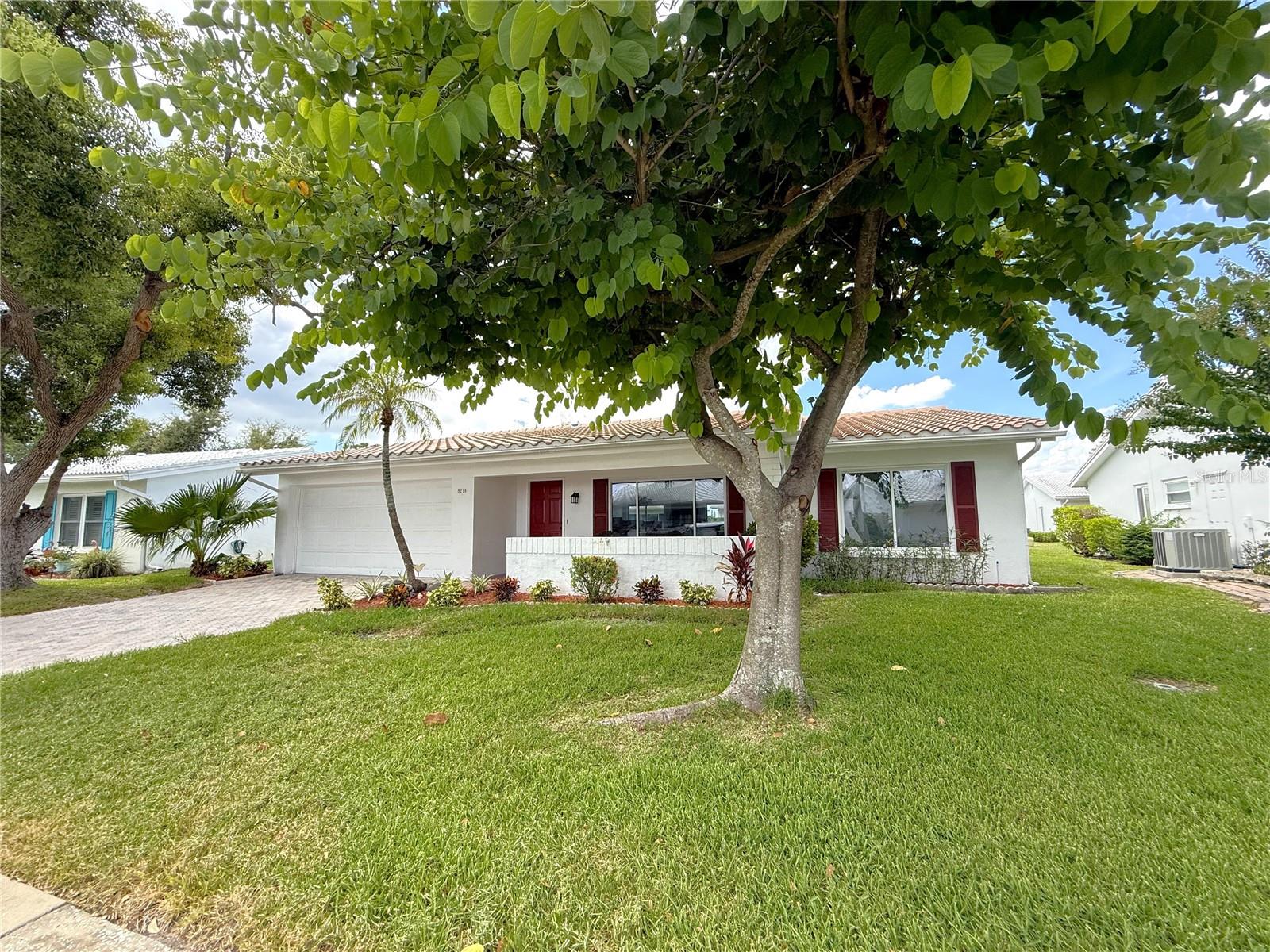 Discover the perfect blend of comfort and modern living in this Beautifully Updated Home, ideally situated with a spacious front patio and a stylish brick paver driveway. This remarkable residence boasts a brand-new tile roof and HVAC system, along with newer energy-efficient low-e double pane windows, a new water heater, and an upgraded electric panel. The kitchen is a culinary delight, featuring stunning granite countertops, a chic subway tile backsplash, soft-close shaker cabinetry, contemporary drawer pulls, and sleek stainless-steel appliances, complemented by a custom vent hood and recessed LED lighting. You will love the expansive breakfast bar and conveniently located laundry area with additional storage to enhance functionality. The open floor plan is perfect for entertaining, showcasing a custom wet bar adorned with a glass tile backsplash, a wine rack, and a refrigerator, along with a cozy Florida room that features a wood-burning fireplace. Additional highlights include a thoughtfully designed layout that incorporates a third bedroom, which can serve as a home office, craft room, or gym, accentuated by a modern barn door. The home is adorned with neutral décor, knockdown textured finishes, freshly painted walls and ceilings, recessed LED lighting, updated 5 1/2-inch baseboards, new interior doors, and contemporary hardware in a sleek black finish. Luxury vinyl and tile flooring flow seamlessly throughout the space. The private master suite offers a walk-in closet and an ensuite bath featuring a walk-in shower, an updated vanity with a granite countertop, and custom tile work. An additional bathroom, also updated with a granite countertop, custom tile, a low-flow toilet, and LED lighting, is sure to impress guests. The large garage features epoxy-finished flooring, adding to the home's appeal. For golf enthusiasts, the Mainland's Golf Course is conveniently located in the neighborhood, while a nearby pool and clubhouse provide easy access to leisure activities. The home is also close to Bill Jackson’s Shop for Adventure, Aldi’s, and Freedom Lake Park, which offers a dog park with separate areas for large and small dogs, fitness stations, fishing spots, grilling areas, picnic tables, pavilions, a brand-new playground, a walking track, and the Korean War Memorial, making it an ideal location for outdoor enthusiasts. Easy Access to Gulf Beaches, Sam’s Club, Coffee Shops, Fitness Centers, shopping, dining, Helen Howarth Park, Equestrian Trail, Dog Park and Forbes recreation area, I-275, St. Pete/Clearwater and Tampa International Airports. Come see all of the features this beautiful home and active community have to offer; it won't last long!