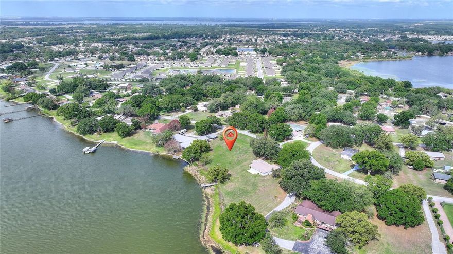 EXTREMELY RARE LAKEFRONT LOT ON BEAUTIFUL EAGLE LAKE!!!  With so few lakefront lots remaining in Winter Haven, don't miss your chance to own this expansive (.85 acre) lot with NO HOA!  Bring your imagination and build your very own lakefront residence and start making memories immediately!!!  You are starting with a clean slate, so you are able to create your own custom masterpiece.   Eagle Lake is approximately 640 acres and is home to many species of fish including largemouth bass, crappie, and bluegill.  It has a mean depth of 12 feet and a maximum depth of 32 feet.  Boating and water skiing are welcomed on these crystal blue waters, so bring all of your water toys.  Don't miss out!  Eagle Lake/Winter Haven is conveniently located between 2 international airports, Orlando International and Tampa International.  Lakeland Linder Airport is within very close proximity to this lot and is rapidly expanding it's Avelo Airline.  Shopping, medical, dining and entertainment are all just minutes away.  LEGOLAND, FL is also only 8 miles from this beautiful lakefront property.