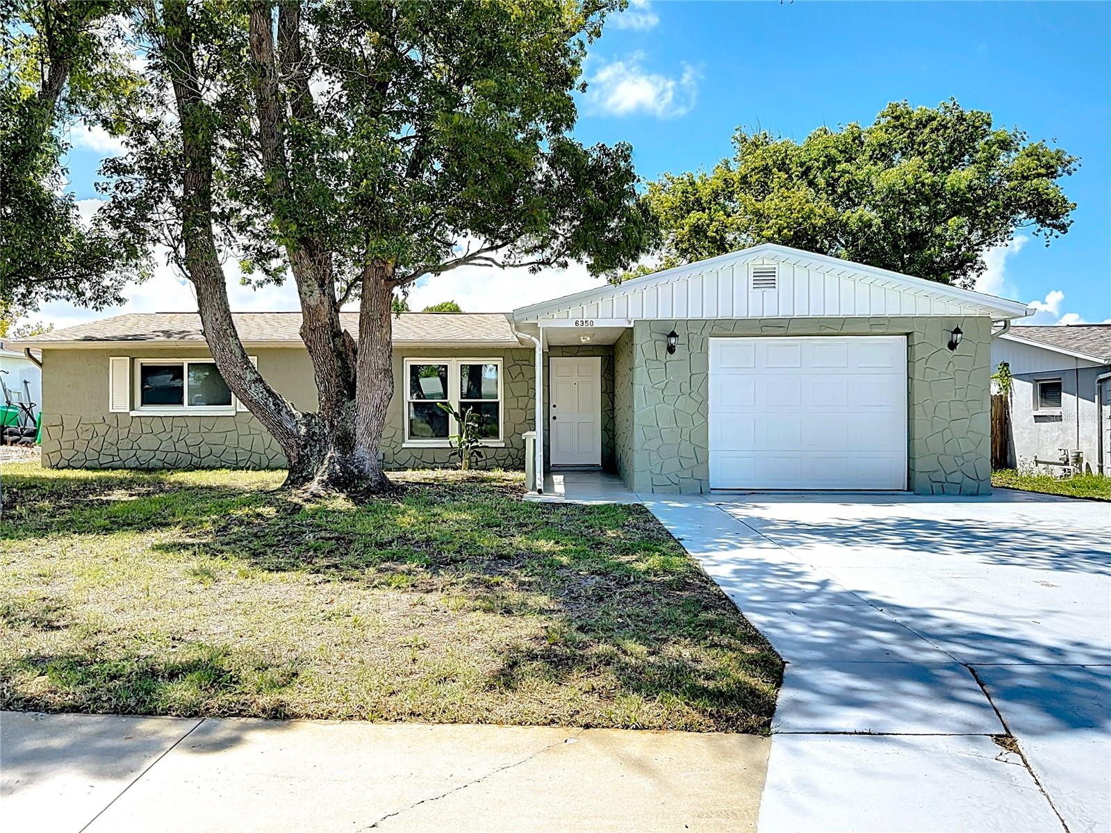 Charming 3-Bedroom Home in Desirable New Port Richey!
Welcome to 6350 Edenmore Ave, a bright and inviting 3-bedroom, 2-bathroom home that perfectly blends comfort, functionality, and Florida charm. This thoughtfully designed residence offers plenty of closet space, tons of natural light, and a layout that feels both spacious and welcoming.
Enjoy your morning coffee or evening relaxation on the screened lanai. Your fully fenced yard is perfect for pets, outdoor entertaining, or simply soaking in the Florida sunshine. This home provides peace of mind while offering easy access to nearby amenities, shopping, and recreation.
Whether you are hosting friends, spending time with family, or enjoying quiet moments, this home provides the perfect backdrop for your Florida lifestyle. Don’t miss your chance to make 6350 Edenmore Ave your next home! Charming 3-Bedroom Home in Desirable New Port Richey Location
Welcome to 6350 Edenmore Ave, a bright and inviting 3-bedroom, 2-bathroom home that perfectly blends comfort, functionality, and Florida charm. This thoughtfully designed residence offers plenty of closet space, tons of natural light, and a layout that feels both spacious and welcoming.
Enjoy your morning coffee or evening relaxation on the screened lanai, overlooking a fully fenced yard—perfect for pets, outdoor entertaining, or simply soaking in the Florida sunshine. Located in the highly sought-after flood zone X, this home provides peace of mind while offering easy access to nearby amenities, shopping, and recreation.
Whether you’re hosting friends, spending time with family, or enjoying quiet moments, this home provides the perfect backdrop for your Florida lifestyle. Don’t miss your chance to make 6350 Edenmore Ave your next home! Located in Zone X!