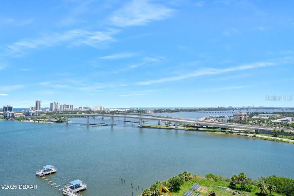 Welcome to your dream river views on the 15th floor! This beautifully renovated 2-bedroom plus office, 2-bath condo offers a perfect blend of modern elegance and serene waterfront living. Step inside to a light-filled layout with luxury vinyl plank flooring, crown molding, and expansive sliders framing breathtaking views of the Intracoastal and three iconic bridges. The gourmet kitchen features granite countertops, stainless steel appliances, and 42-inch cabinets flowing seamlessly into the dining area with a grand chandelier. The spacious family room opens to an oversized balcony ideal for morning coffee or evening sunsets. The primary suite boasts balcony access, a custom walk-in closet, and a spa-like bath with dual vanities, jetted tub, and walk-in tile shower. The second bedroom offers river views, plush carpet, and an updated full bath. A private office/den, in-unit laundry, and pristine condition throughout complete the home.
Enjoy maintenance free waterfront living at the fabulous MG on the Halifax and you almost never have to leave the condo! The Marina Grande is an active community, the residents are offered Yoga Classes, Poker Night, Monday Night Football, Coffee Time, Movie Night, Mahjong, Thursday's Food Truck Night, and Grill & Chill with your neighbors.
This is More Than a Home; It's the Embodiment of the Florida Lifestyle. Pet-Friendly and Just Minutes from Downtown Daytona Beach, The World's Most Famous Beach, NASCAR Races, and Endless Outdoor Activities. Don't Miss Out on This Incredible Opportunity!