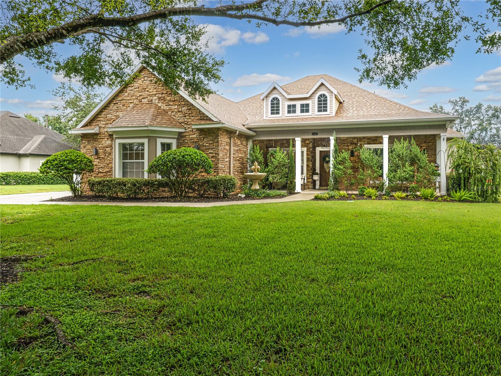 Welcome to a home that does more than check boxes—it inspires. Perfectly located in the highly sought-after community of The Park at Wolf Branch Oaks, this designer-renovated residence features 3,245 square feet of beautifully curated living space, thoughtfully crafted for comfort, functionality, and style—all with a low annual HOA fee and no CDD.
From the moment you arrive, the difference is clear. A new roof (2023) and custom dormers (2024) enhance the exterior, while inside, an elegant open floor plan unfolds with seamless luxury vinyl plank flooring (2023) and custom finishes throughout. Every room reflects the vision of a professional home designer.
At the heart of the home, the fully remodeled kitchen (2024) features quartz countertops, premium KitchenAid Professional Series appliances, 42” custom cabinetry, and a massive floor-to-ceiling pantry to meet all your storage needs. The kitchen overlooks the great room, anchored by a striking floor-to-ceiling stone fireplace—with gas—and has sweeping views of the pool and backyard oasis. Whether entertaining or unwinding, this space is as welcoming as it is functional.
The owner’s suite is a true sanctuary—expansive and elegantly appointed, with its own gas fireplace, room for a sitting area or home gym, and a show-stopping, boutique-style walk-in closet that’s sure to impress. On the opposite wing, three large additional bedrooms provide peaceful privacy and versatile design, each with generous storage and thoughtful organization.
Step outside into your personal oasis. The expansive backyard is fully fenced and backs up to protected green space—no rear neighbors—creating both privacy and tranquil views. A resurfaced pool deck (2025) with Shark Grip coating surrounds your resort-style pool, complete with a new pump (2025) and ample space to dine, lounge, or entertain under the Florida sky—all on your own .30-acre lot.
Key Updates Include:
New water heater (2024)
New lighting, crown molding, and additional custom interior details
Professionally designed spaces throughout
Gas to all fireplaces
This home is more than just a beautiful place to live—it delivers a lifestyle. The Park at Wolf Branch Oaks spans over 45 acres of shared natural space, including a private 13-acre park with walking trails and open greens. Residents enjoy community events, quiet streets, and a rare sense of belonging. The neighborhood even has its own private water system—meaning better water quality and lower utility bills.
Served by top-rated Lake County schools and ideally located just 10 minutes from Mount Dora, 30 minutes from Orlando, and less than an hour to the coast, you are perfectly positioned for work, play, and peaceful living.
This isn’t just a house—it’s your next chapter, designed to be lived in and loved.