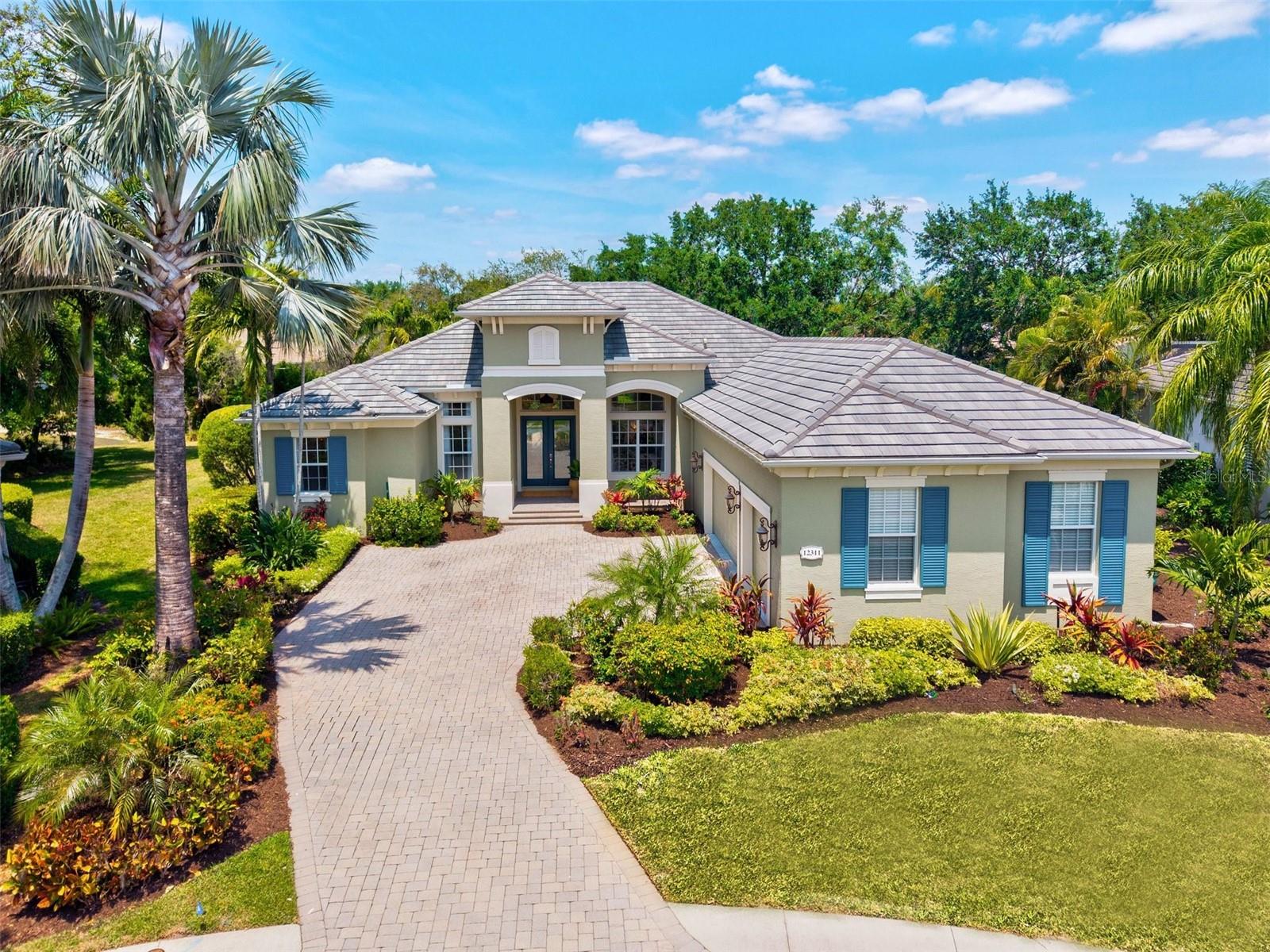 No need to stress about remodel costs— this home has already done the heavy lifting (and drywall dust) for you! Completed in February 2025, this home is one of a kind! Welcome to 12311 Newcastle Place in the heart of Lakewood Ranch, where modern luxury meets meticulous craftsmanship. This isn't just a renovation—it’s a full-blown transformation. Taken down to the studs and reimagined with today's discerning homeowner in mind, this stunning residence showcases a top-to-bottom remodel that would make even the pickiest HGTV star swoon. Walls were removed to create an open, airy layout that flows effortlessly from room to room, flooded with natural light and elevated by designer finishes throughout. The gourmet kitchen is a showstopper, featuring custom cabinetry, high-end appliances, gleaming quartz countertops, and a generous island perfect for entertaining. Wide-plank flooring, sleek lighting, and elegant architectural touches add to the home's polished vibe. Is entertaining your thing? The bar is stocked and ready for you to put your favorite brew on tap! The primary suite feels like a boutique hotel retreat, complete with a spa-inspired bathroom, amazing free standing soaking tub, with beautiful architectural elements throughout and spacious his-and-hers walk-in closets. Every inch of this home—from the guest baths to the living spaces—has been curated for comfort, style, and function. For added peace of mind, the HVAC units and water heater are all newer (2021 and 2020). This luxurious residence is located in the Greystone section of Lakewood Ranch Golf and Country Club. Boasting a large, cul-de-sac lot, this move-in ready masterpiece offers the perfect blend of luxury living and peace of mind. Why wait through construction chaos when you can have it all—right now?