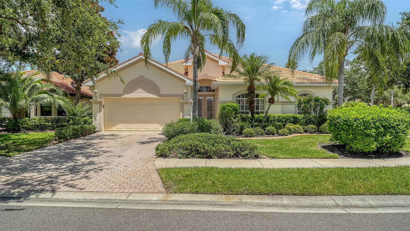 Welcome Home to this meticulously maintained and maintenance free 4bed/3 bath + den with pool behind the gates of Lakewood Ranch Country Club! You will love the light and bright open floor plan with wood plank tile floors and 2512 SF of living space. The impressive chef's kitchen features 42" cabinets and granite counters with stainless appliances open to the family room making it the perfect space for cooking and entertaining. There is a formal dining area and living room with sliders to the pool plus a den/bonus room with french doors that can serve many purposes. Retire to your primary suite with a generous walk in closet and bath with dual sinks. The split floor plan is the perfect layout with 3 additional bedrooms and laundry providing privacy for guests or family members. Relax and unwind by the pool and patio with plentiful deck space and covered area for lounging or for an outdoor kitchen. The oversized end lot with additional yard space and natural landscaping is the ultimate in privacy and seclusion. Numerous upgrades to this home include newer roof, newer AC, new pool pump and filter, updated washer/dryer and pebbletec pool surface ! Lakewood Ranch Country Club offers an abundance of amenities that make it the premier community for golf with access to 4 championship golf courses and 18 tennis courts, pickleball, fitness center, and an elegant clubhouse with so many social events. There are numerous membership options available. This premier location offers close proximity to UTC premier shopping, dining, cultural attractions, A-rated schools, and beautiful Gulf beaches just minutes away. This is the ultimate Country Club Lifestyle!