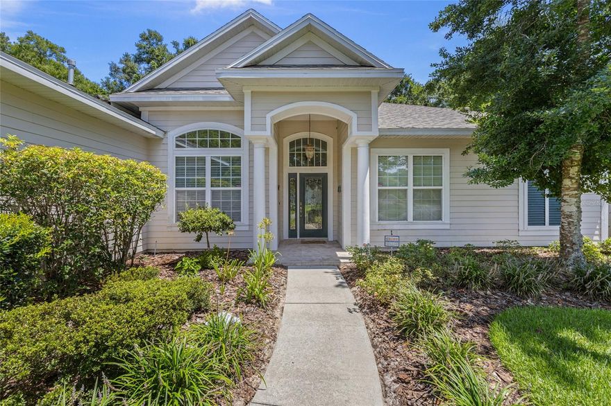 Welcome to this beautifully maintained, one-owner home in the sought-after Dunnideer section of Cobblefield. This thoughtfully designed residence offers a true 3-way split floor plan with 4 bedrooms, 4.5 baths, and a dedicated home office. Upon entry, durable tile flooring flows through the high-traffic areas, while hardwood floors add warmth and elegance to all bedrooms and the living room. The formal dining and living rooms welcome you into the home and feature French doors to the screened lanai. The spacious kitchen is both elegant and functional, featuring ample wood cabinetry, granite countertops, and newer stainless Bosch appliances. Just off the kitchen, the light-filled eat-in area and family room includes a focal-point gas fireplace and peaceful views of the landscaped backyard and lanai. The primary suite is a private retreat, complete with French doors to the lanai, two walk-in closets, and a spacious en-suite bathroom. Across the home, a well-appointed guest suite near the laundry utility off the garage includes a private bath and is ideal for multi-generational living. Two additional bedrooms, each with its own full bath, were enlarged and are tucked into their own wing, ensuring privacy for all. The dedicated office is off the primary bedroom hallway and across from the convenient half bath, which opens to the screened lanai. The fully fenced and well-manicured yard with no rear neighbor is an ideal backdrop for both entertaining and everyday relaxation. Ideally located near Haile Plantation, Celebration Pointe, I-75, and UF/Shands, this home blends timeless finishes with a smart layout and unbeatable convenience. Move-in ready and full of thoughtful upgrades including new roof and updated HVAC and water heater, this Cobblefield gem is ready to welcome you home!