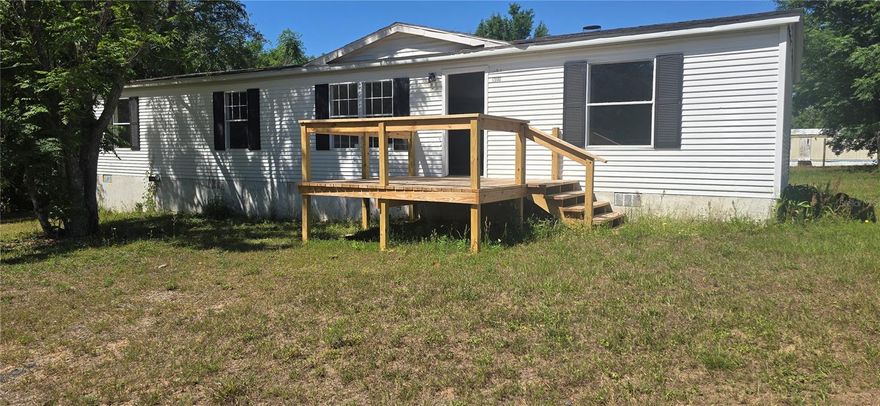 Welcome to your dream haven in the heart of rural Umatilla, FL! This stunning 1995 triple wide manufactured home, spanning over 1,500 sq ft, offers 3 bedrooms and 2 bathrooms, remodeled for modern comfort. Step inside to brand-new laminate flooring that flows through an open, airy layout—perfect for family gatherings or quiet evenings. The updated kitchen sparkles, ready for your culinary adventures, and a new AC (installed before closing) ensures year-round coziness. Set on nearly 1/3 acre, this peaceful lot feels like a countryside escape. Three entry points, two with spacious wooden decks, invite you to sip coffee under the stars or host summer barbecues. Whether you’re unwinding in the primary suite or exploring nearby trails, this move-in-ready gem promises a warm, welcoming lifestyle. Don’t miss your slice of Florida serenity—schedule a tour today!