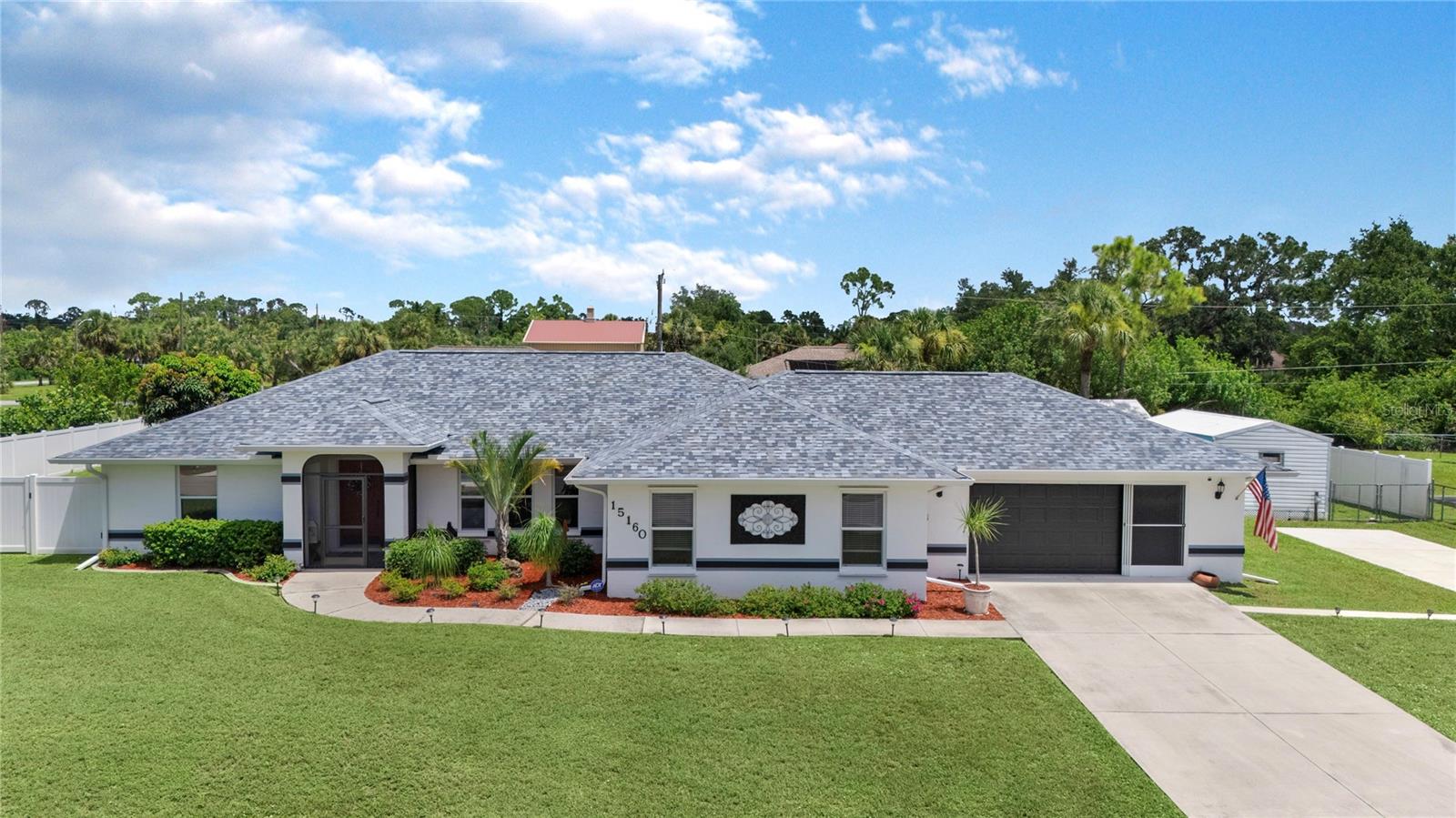 Welcome to 15160 Buswell Avenue, Port Charlotte, FL – This beautiful 3-bedroom, 2-bathroom home offers comfort, style, and plenty of space both inside and out. Step inside to find elegant ceramic tile flooring throughout, an upgraded kitchen featuring stunning granite countertops, rich oak cabinetry, and ample storage space for all your culinary needs.
The open floor plan flows seamlessly into the oversized screened lanai, where a heated pool awaits for year-round enjoyment. The backyard is a true Florida oasis – fully fenced for privacy, adorned with lush landscaping, and offering nearly a half-acre lot for endless possibilities. Two storage sheds on the property provide extra room for tools, hobbies, or outdoor gear.
Whether you’re hosting family gatherings, enjoying the sunshine by the pool, or simply relaxing in your serene setting, this home offers it all. Located in desirable Port Charlotte close to shopping, dining, schools, and Gulf Coast beaches, it’s the perfect place to call home.