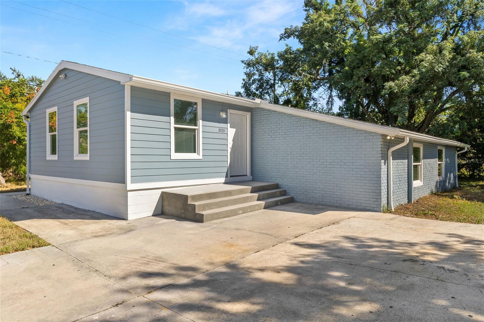 Completely renovated duplex delivering near new-build quality with excellent income potential. All work permitted and brought to current code. Front unit is 4BR/2BA; rear unit is 3BR/1BA—each featuring granite counters, stainless appliances, in-unit washer/dryer, LVP flooring, and impact windows. Systems are new throughout: plumbing, electrical with new service meters, HVAC, and water heaters. Each side enjoys private yard space and ample parking on an extended lot. It's located in Flood Zone X— NO FLOOD INSURANCE REQUIRED. The home is surrounded by new construction and close to major Tampa employment corridors. 2025 Tampa Housing Authority payment standards for ZIP 33619 indicate approx. $3,350 for 4BR and $2,750 for 3BR, suggesting a combined rent potential around $6,100/month. Turnkey investment or live/rent opportunity in a rapidly growing area. Schedule your showing today!