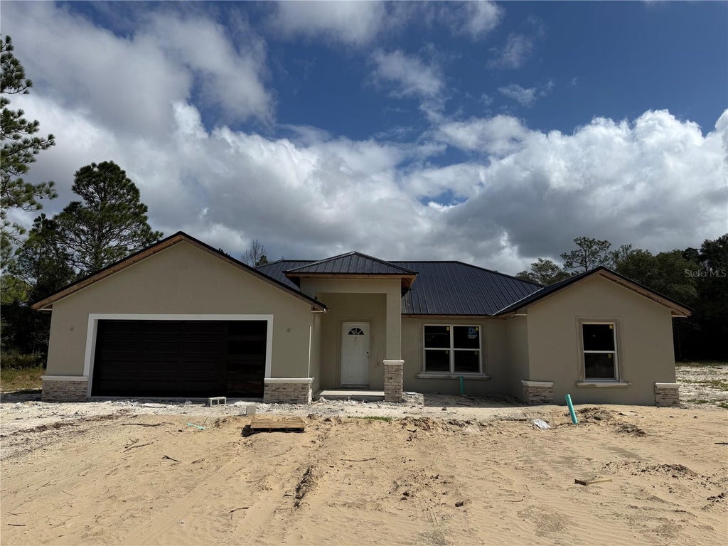 Photo of 4451 SW Begonia Ct, Dunnellon, FL 34431 (MLS # OM734933)