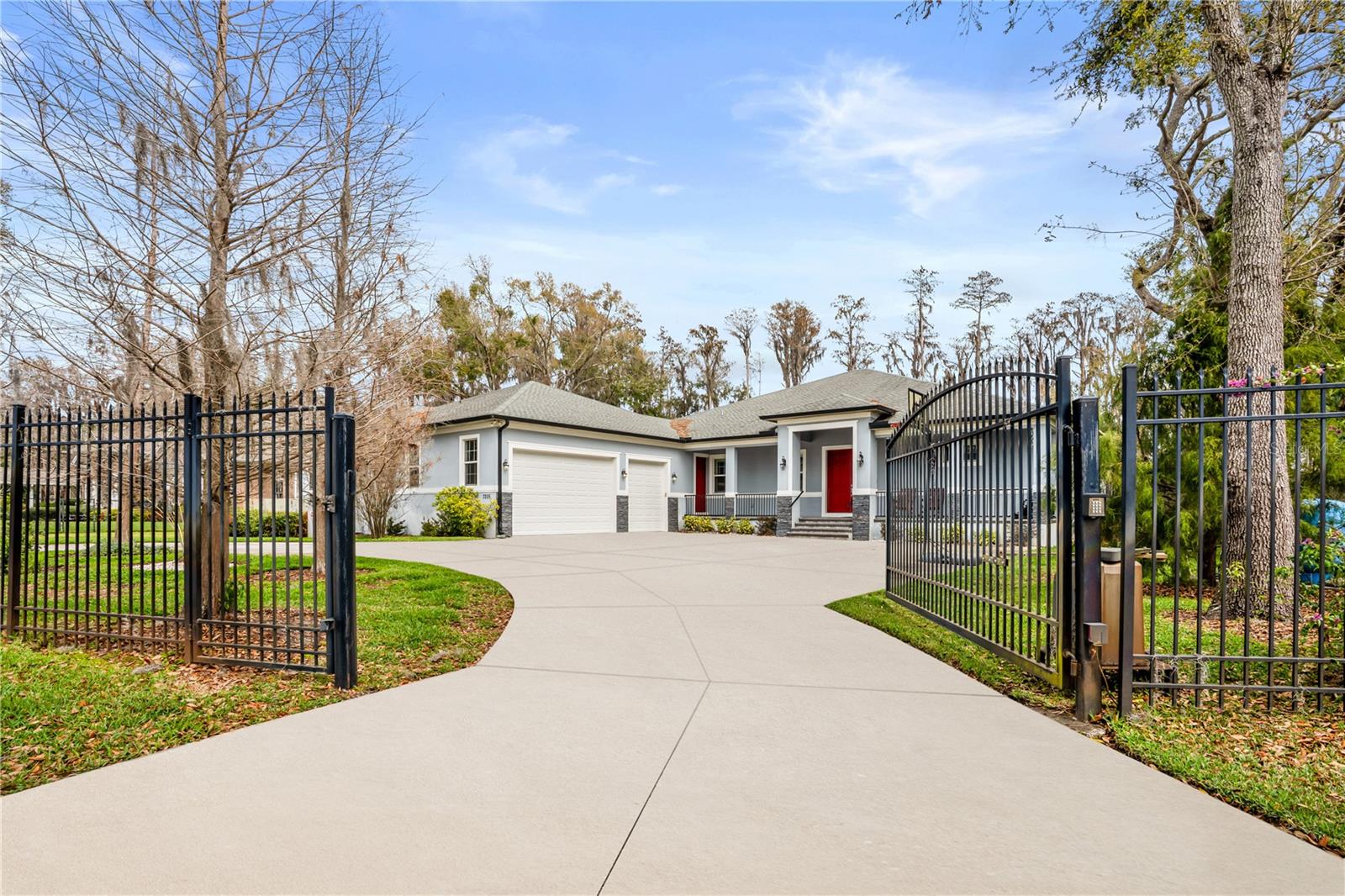 Luxury Lakefront Custom Home for Sale in Odessa, FL – No HOA! Built in 2017, this contemporary masterpiece offers 4,935 sq. ft. of living space and 6,478 sq. ft. in total. There is no HOA, and it is in the Steinbrenner High School zone!
Step inside to an inviting open-concept floor plan with soaring 12-foot ceilings in the main living areas and 10-foot ceilings in the bedrooms. Large hurricane-impact windows flood the space with natural light and provide breathtaking lake views from every room.
This home features four spacious bedrooms and 3.5 luxury bathrooms with high-end finishes; the fourth bedroom with a full bathroom is an office with built-in cabinets that could be converted into a fourth bedroom. There is also a 3-car garage with 8-foot-high doors, built-in shelving, and an impressive 1,189 sq. ft. air-conditioned bonus room or gym with a private entrance and half bathroom.
For an additional cost, the original builders can transform the bonus room into 1- 3 additional bedrooms or a mother-in-law room (see floor plan pictures).
The gourmet kitchen is a chef’s dream. It has double convection, an oversized island, elegant dark granite countertops that perfectly contrast with luxury light tile floors, custom wood cabinetry, and a spacious walk-in pantry for ample storage.
Additional highlights include custom cabinetry in the bathrooms and bedroom/office, a built-in entertainment center and surround sound system, a cozy electric fireplace, stone columns, plantation shutters, custom blinds for privacy and style, a water filtration system, a new reverse osmosis system for pure, clean water. The house has a hard-wired security system for peace of mind.
Enjoy Florida’s stunning weather with 150 feet of lakefront access and a covered private dock on Rock Lake, ideal for boating, jet skiing, or kayaking.
Outdoor features include a caged, expansive pool, perfect for relaxation and entertainment,
A circular driveway with an automatic privacy gate for added curb appeal and security.
This home is designed with top-tier construction and energy-efficient features, such as concrete block walls with stucco flex elastomeric coating for durability, hurricane windows with reinforced frames and impact-resistant glass, and spray foam roof insulation for energy savings, GAF Timberline shingles with 25–30-year lifespan, and three top-brand conditioners.
A propane tank for a standby generator will ensure power during outages, and elevated 51-foot construction will provide added peace of mind during Florida’s rainy season.
Nestled in a peaceful neighborhood, this Odessa lakefront home offers a rare combination of luxury, comfort, and natural beauty. Enjoy tranquil east-facing sunrises and access both Rock Lake and Lake Josephine for endless water activities and relaxation.
Ideally located in a cul-de-sac just minutes from the Veterans Expressway, Citrus Park Mall, great restaurants, Northwest Elementary, and Steinbrenner High Schools, this property provides convenient access to Tampa International Airport, top shopping destinations, and the vibrant Westshore district.
Don’t miss this rare opportunity to own a slice of paradise! Contact us today to schedule a private tour and explore the possibilities of customizing this lakefront dream home to fit your needs.