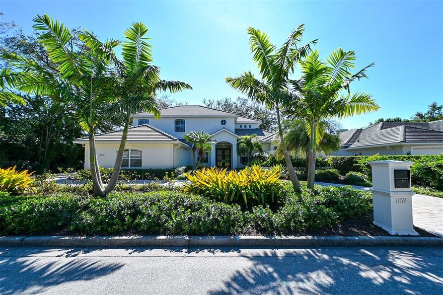 This extensively remodeled “West of Trail” home by Yoder Homes and Remodeling was completed in 2021. It is situated on a 11800 sq ft lot allowing for a wide circular drive and three car side entry garage. Upon entering the home one instantly senses the elegance and high-end designer finishes that make this residence special. Oversized porcelain tiles run throughout the first floor which boasts ten foot high ceilings. All windows and doors are hurricane impact rated. Relocating the kitchen to the rear of the home has created a large family living area with perfect access to the outdoor kitchen and pool as well as providing abundant daylight through an extensive wall of glass overlooking the fenced garden with lush landscaping. The formal living and dining areas also open to the lanai  complete with gas fireplace, pool and spa, with ample room for seating and outdoor dining. The downstairs office can also be used as the fifth bedroom complete with closet and access to a full bath. The main bedroom also opens to the pool area and is complete with a custom designed walk-in closet and a spectacular bath. The second level with a ceiling height of nine feet has three additional bedrooms, two baths and a large bonus room with sliders opening to a sun deck. Some special features of this home include a Sonos Surround system, Lutron motorized shades, an Aquasanic whole house filtration system, a Phyn water leak detection system and ForeverLawn synthetic grass in the garden. This residence is conveniently located to downtown Sarasota, Sarasota Memorial Hospital, Selby Gardens, Southside Village, dining, shopping venues, and Siesta Key.