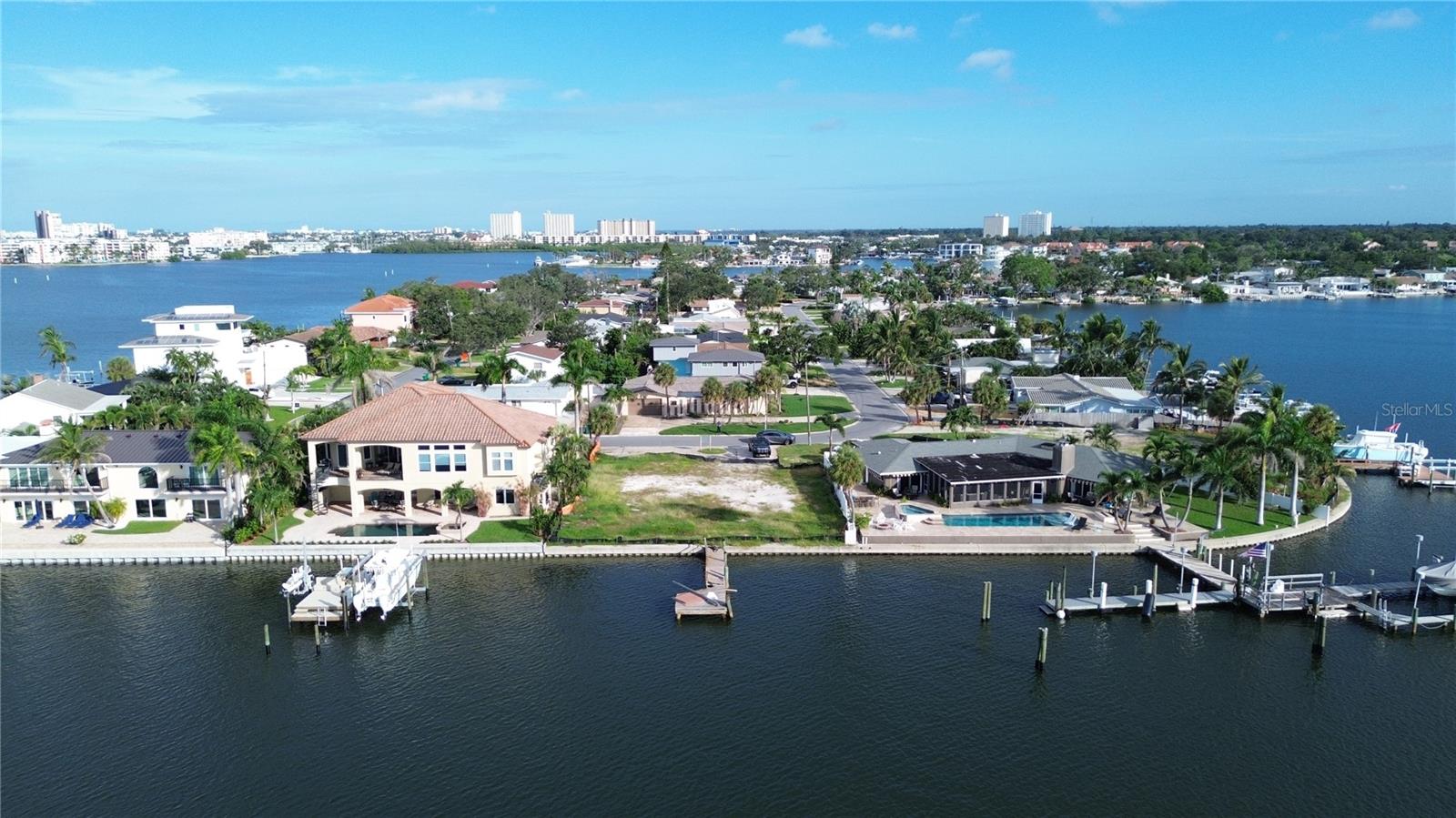 Exceptional opportunity to secure a ready-to-build waterfront lot in highly desirable Pasadena Golf Club Estates. This cleared lot features 85 feet of deep-water protected harborage with a dock and views across Boca Ciega Bay—ideal for boating and waterfront living.
This fabulous lot has approved architectural plans for a 5-bedroom + office, 4.5-bath, 3,646 sq. ft. luxury home with expansive terraces and ample garage space. With approvals already in place, investors and homeowners alike can fast-track construction and begin building immediate equity in one of St. Petersburg’s most coveted neighborhoods. Or feel free to bring your own plans and build the home you have always envisioned.
The location offers unmatched convenience: 3 grocery stores within 1.5 miles, Downtown St. Petersburg only 12 minutes away, and Tampa International Airport just 40 minutes from your doorstep. This is a rare chance to invest in premium waterfront property with approvals in hand.