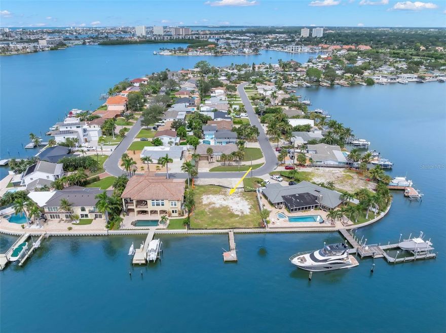 Exceptional opportunity to secure a ready-to-build waterfront lot in highly desirable Pasadena Golf Club Estates. This cleared lot features 85 feet of deep-water protected harborage with a dock and views across Boca Ciega Bay—ideal for boating and waterfront living.

This fabulous lot has approved architectural plans for a 5-bedroom + office, 4.5-bath, 3,646 sq. ft. luxury home with expansive terraces and ample garage space. With approvals already in place, investors and homeowners alike can fast-track construction and begin building immediate equity in one of St. Petersburg’s most coveted neighborhoods. Or feel free to bring your own plans and build the home you have always envisioned.

The location offers unmatched convenience: 3 grocery stores within 1.5 miles, Downtown St. Petersburg only 12 minutes away, and Tampa International Airport just 40 minutes from your doorstep. This is a  rare chance to invest in premium waterfront property with approvals in hand.