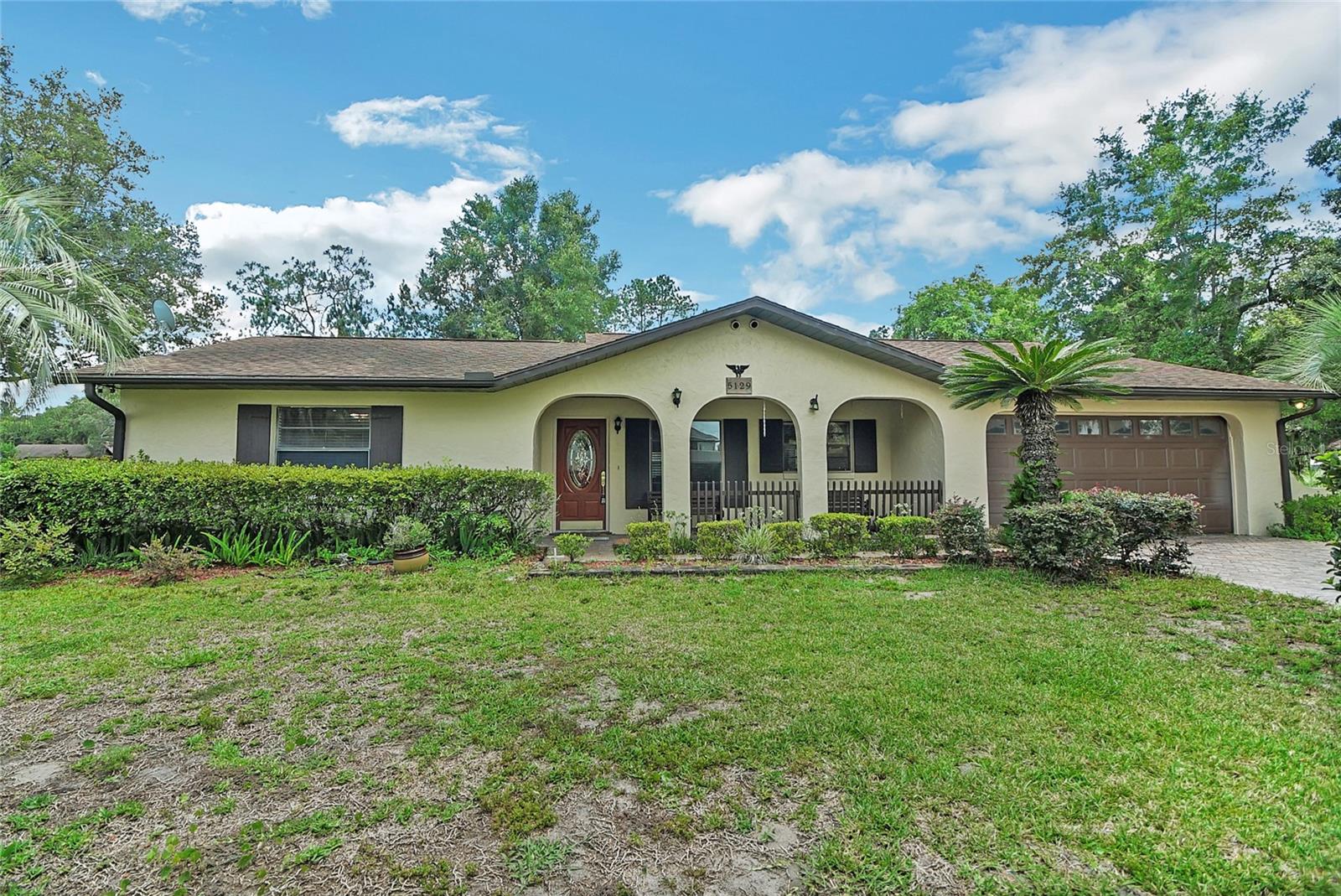 LOCATION, LOCATION!! This sweet house will make a great family home with some TLC and updates. The Location is excellent, close to 301, The Villages, restaurants, the Charter School on CR 466 and so much more! The floor plan is awesome with a Living and Dining room plus a Family room. The bedrooms feature a split bedroom plan with the master on one side and the 2nd and 3rd bedrooms on the opposite side of the home. The screen, covered patio on the rear of the home overlooks the private backyard. The storage shed stays and is perfect for lawn equipment or outdoor toys. No rear neighbors! Situated on a third of an acre, this is a great opportunity to own in a prime location!