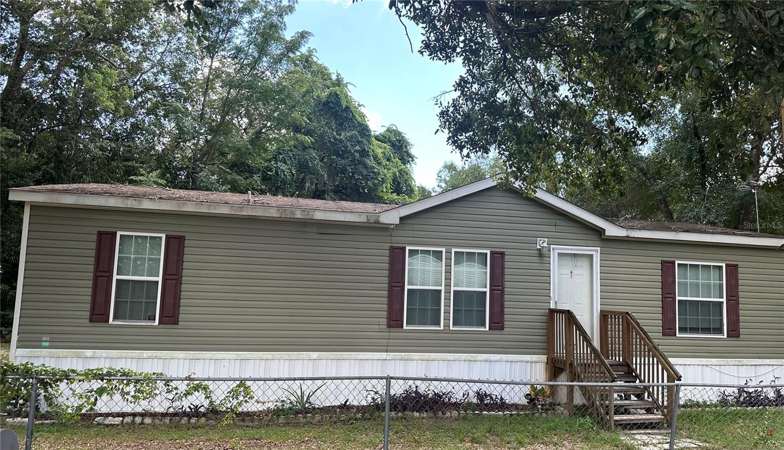 If you're looking for private, quiet and serene, this location is for you. Located off of Hwy 44 in Leesburg, this 2017 double-wide mobile home sits on 2.2 acres of land. Home has well and septic. This would be a great home for a First-Time Homebuyer.
The shed is fully insulated with electrical. It has wood tile and a mini split ac/heat unit. The contents in the shed do not convey.
Schedule your showing today.