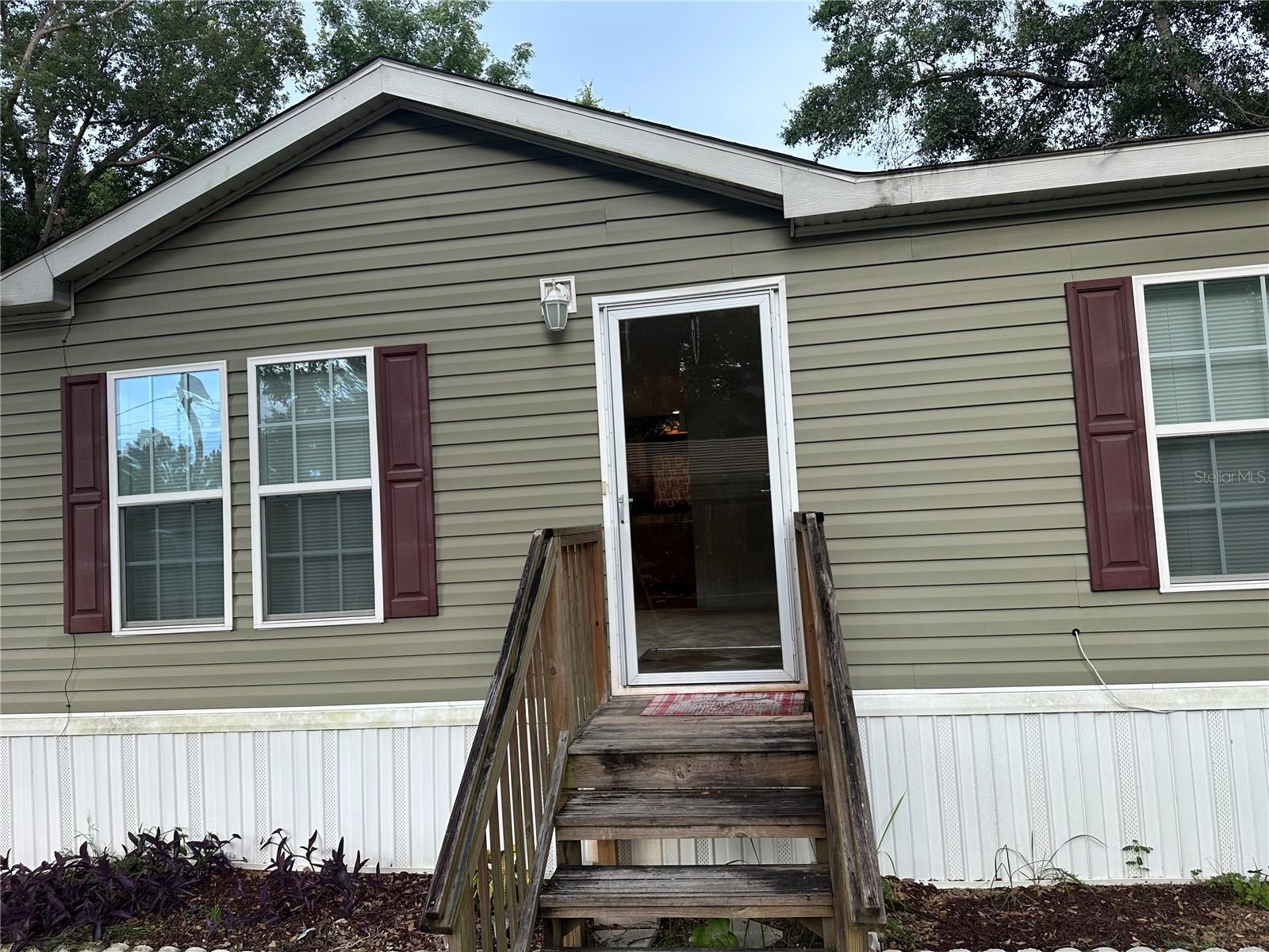 If you're looking for private, quiet and serene, this location is for you. Located off of Hwy 44 in Leesburg, this 2017 double-wide mobile home sits on 2.2 acres of land. Home has well and septic. This would be a great home for a First-Time Homebuyer.
The shed is fully insulated with electrical. It has wood tile and a mini split ac/heat unit. The contents in the shed do not convey.
Schedule your showing today.