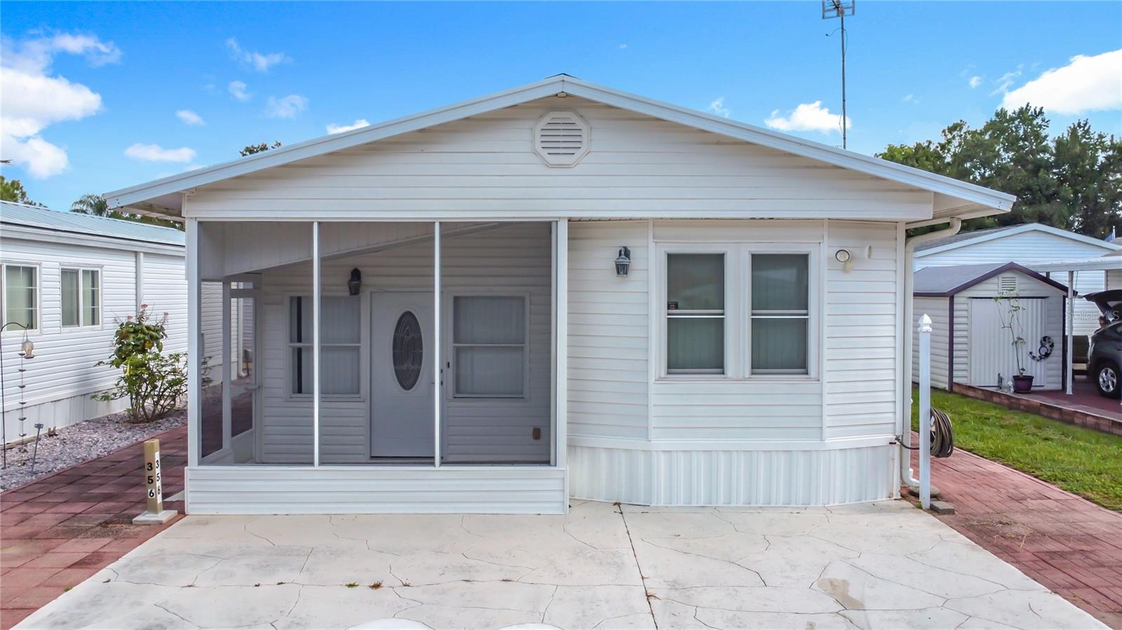 Welcome to this charming, fully furnished manufactured home located in the quiet and sought-after 55+ community of Citrus Ridge. Nestled in a peaceful neighborhood, this home offers comfort, convenience, and a vibrant lifestyle just minutes from major attractions like Disney, shopping centers, restaurants, and major highways. Step inside to a spacious living room featuring brand-new windows that let in natural light. The inviting kitchen is fully equipped with stainless steel appliances, plenty of storage cabinets, and ample countertop space—perfect for everyday living or entertaining guests. The primary bedroom includes an en-suite bathroom with a relaxing tub and shower combo. Enjoy extra living space in the Florida Room, and unwind year-round in the air-conditioned screened porch with full windows. Whether you’re enjoying your morning coffee or entertaining friends, there’s space for it all. Residents of Citrus Ridge enjoy fantastic amenities including a clubhouse, pool, park, playground, tennis courts, and more—all with a low HOA fee. Don’t miss your chance to live in this well-maintained home in a community that offers both relaxation and fun. Schedule your showing today!