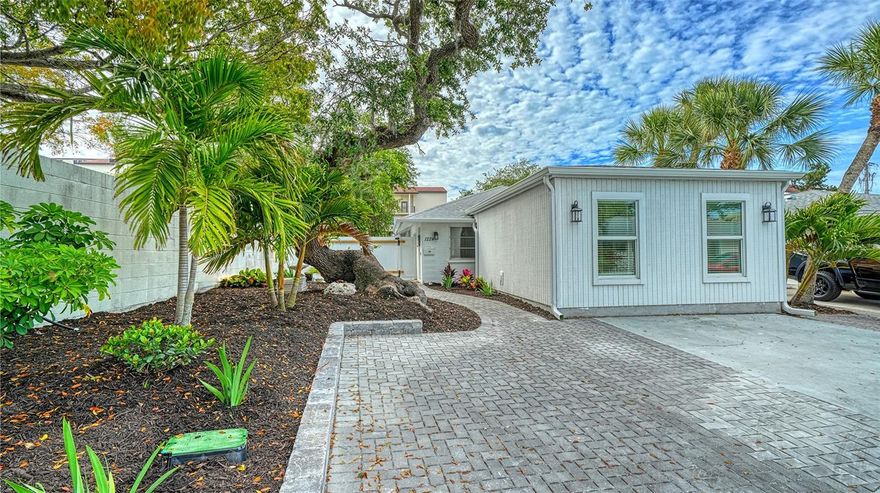 Outstanding remodeled and updated freestanding 3/3 villa in private and beautiful Polynesian Gardens. New ceramic tile flooring throughout. Spacious with large rooms plus 259 extra square feet in glassed in lanai/Florida room which can be used as a family room. office or man cave. The updates include a new addition to the villa of approximately 330 additional square feet and a beautiful second primary suite/third bedroom with an ensuite bath and a laundry room with new washer/dryer and cabinet and closets. 3 bedrooms are split from each other. Primary bedroom has an ensuite bath with a shower and extra shelving for toiletries, large walk-in closet and a set of sliders to the Florida room. Guest bedroom is large enough for two queen size beds plus large closets.  Guest bathroom is right outside of guest bedroom and has a tub/shower with updated vanity with dual sinks. Combo living/dining area with easy access to updated kitchen with pantry and cabinetry galore. New appliances. Living/dining room is large and has a coat closet. New sliding glass door adds sunshine and light and leads to the large private paved side yard and back yard. Large enough for gardening, patio furniture and a barbeque. This villa has been replumbed and the drainpipes were replaced in the entire house in 2017. The roof was replaced by the Association in 2020. New roof on the addition and transition to the existing roof in 2026  Exterior has been freshly painted. New landscaping. Installation of a new 5' high white vinyl fence in the front and rear with a gated storage space. Solar security lights on the rear fence. Many more improvements too numerous to list but available on a feature sheet. Polynesian Gardens is an active community with a clubhouse, heated swimming pool and a newly built fishing pier. Yet the location and setting of Polynesian Gardens allows its owners to enjoy a relaxed coastal lifestyle. The Siesta Breeze free trolley stops in front of the community and will take you to Siesta Village for shopping and eating out, to Turtle Beach and to world renowned Siesta Key beach, America's #1 Beach, known for its powdery white quartz sand. Close to Sarasota's downtown area and cultural centers, there are many venues for entertainment and education. Rentals are allowed and are always in demand. Own your own piece of Paradise.