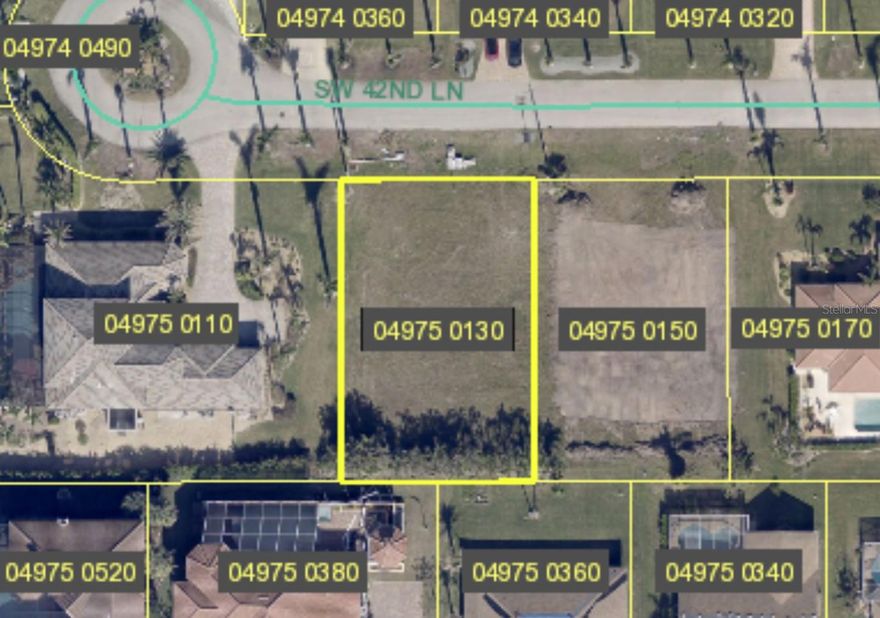 Remarkable opportunity to own a prime lot in the coveted neighborhood of Cape Coral. This ready-to-build
property is situated at the end of a peaceful cul de sac, offering the utmost privacy and tranquility. The surroundings are adorned with luxurious homes, complemented by the scenic beauty of palm tree-lined streets.
Boasting a breathtaking view of the South Spreader Waterway, this lot represents an idyllic setting for your dream
home. The sought-after southwest location Cape Coral ensures convenient access everywhere and a desirable
lifestyle. Adding to the allure, a mature Eureka hedge gracefully enhances the backside of the lot, providing an
extra touch of seclusion. All assessments have been fully paid, and the lot's enviable position across from
waterfront vistas.