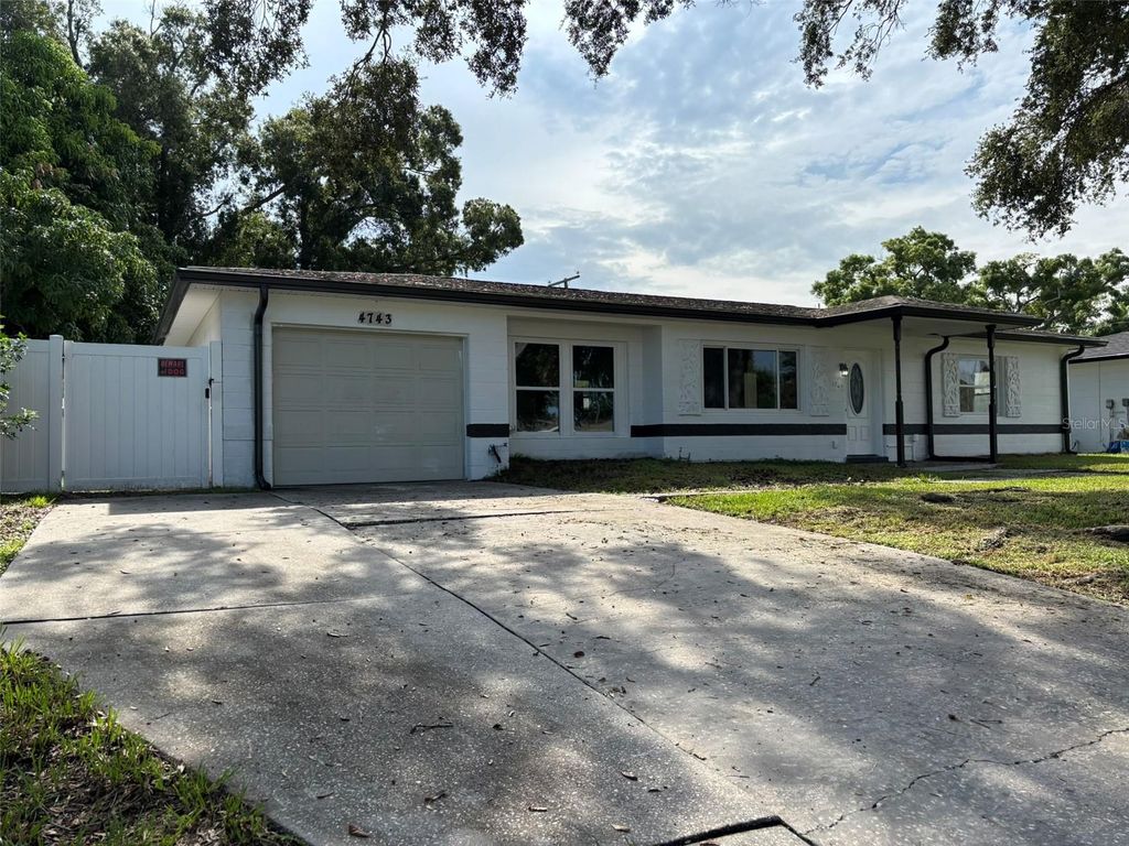 Photo of 4743 Lake Charles Drive N, Kenneth City, FL 33709 (MLS # TB8414600)