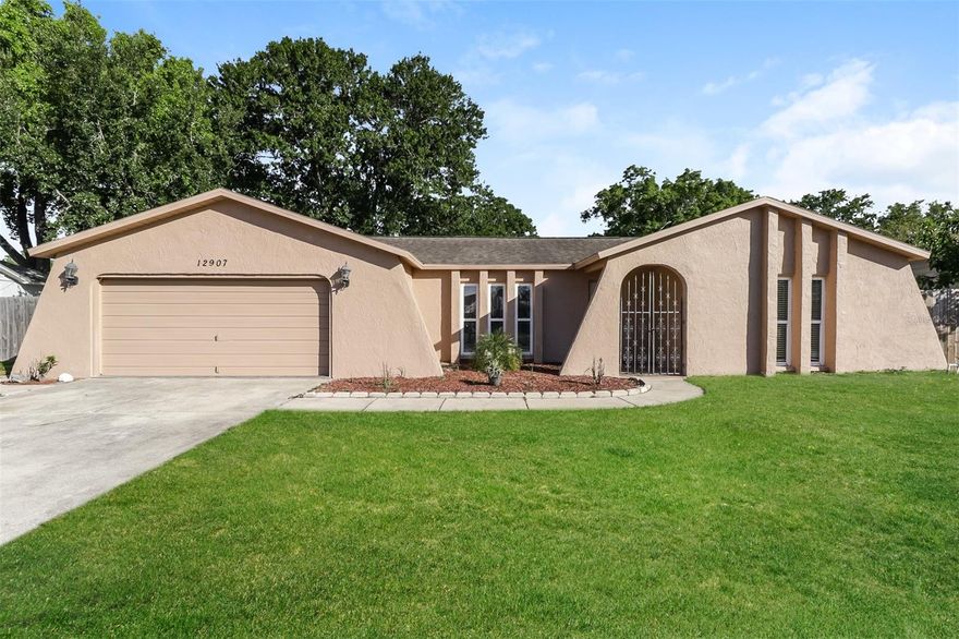 Charm and curb appeal abound for this Hudson home! Step inside into the well-appointed living room, which is positioned at the center of the home. As you move through the dining room you find the kitchen, which boasts stainless steel appliances, hard surface countertops, and ample storage. This split, ranch-style floorplan offers a primary suite, two secondary bedrooms, and a fireplace. Enjoy your private, in-ground pool all year long! Come and see for yourself the possibilities that this home has to offer!