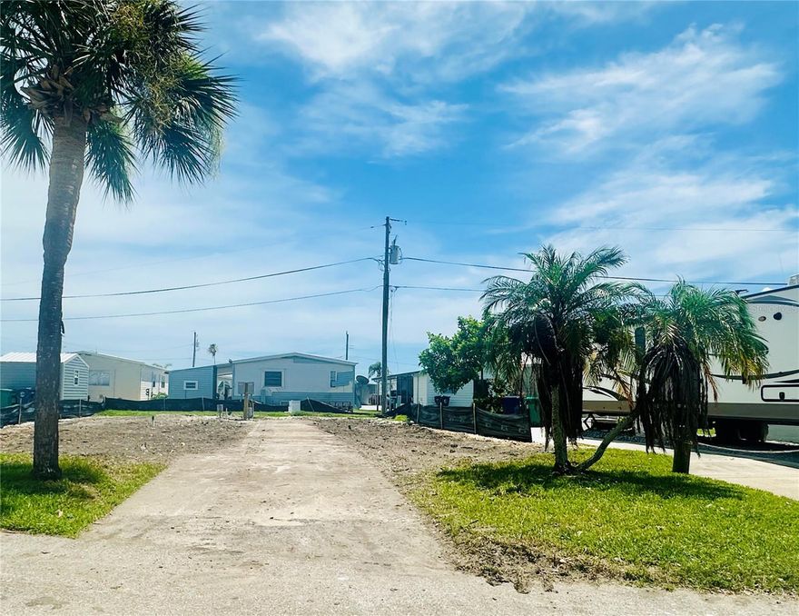 RV LOT Opportunity in TROPIC ISLES COOP – Your Sun Coast Retreat Awaits!  Seize this rare chance to OWN an RV lot in Tropic Isles, a 55+ Resident Owned Waterfront community! READY for your RECREATIONAL VEHICLE. If you're looking to bring your 5th wheel or destination travel trailer,  this is the ideal spot for winter getaways or full-time residency.  Tropic Isles offers a vibrant waterfront lifestyle and activities to enjoy under the Florida sun. Nestled on the beautiful Sun Coast, you'll have easy access to stunning beaches, dining, shopping, and entertainment.  Don't miss out your chance to own your slice of paradise—start building your dream retreat today!