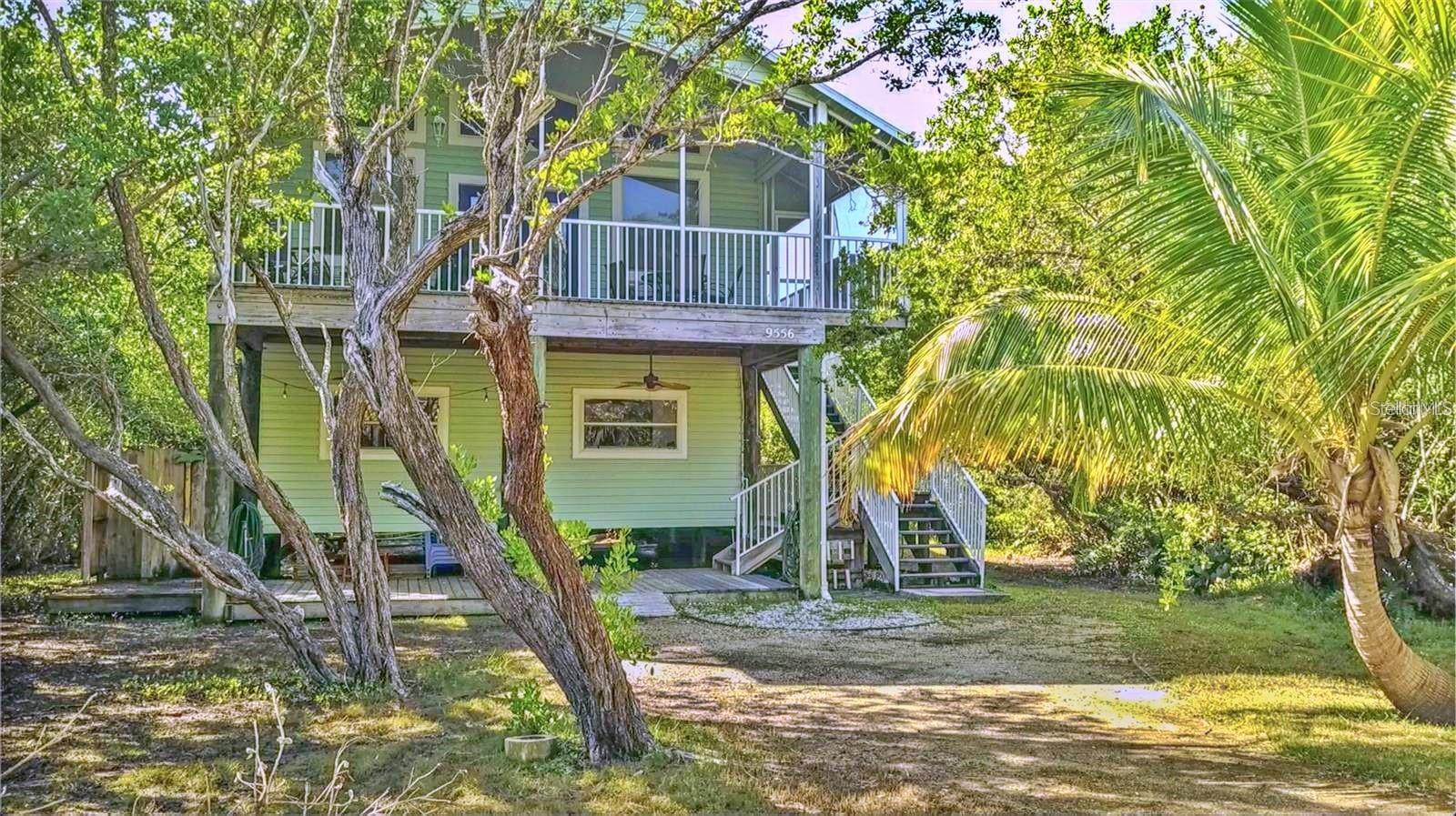 Island life awaits you! This charming 3 bed/2.5 bath stilt-style home offers the perfect blend of modern comfort and seaside living. Home features various upgrades including a new air conditioner (12/21) water heater, all new doors, all new exterior hardie board, all new wooden marine decking/railings, screen porch, plus much more! This gem is just a short walk away from the pristine beach and convenient boat docks where space is plentiful with 3 community docks to choose from, this property is a haven for those who love the ocean and outdoor adventures. Don't miss this rare opportunity to own a piece of beachside paradise. Whether you're looking for a permanent residence, a vacation home, or an investment property, this stilt-style gem has it all. Embrace the island lifestyle and make this dream home yours today!