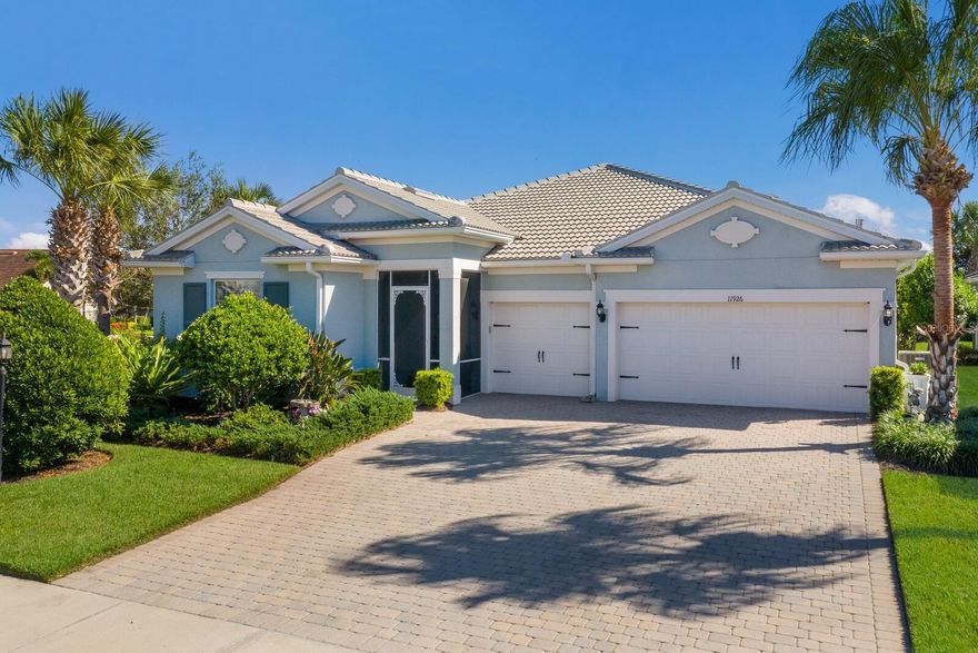 Welcome to Mallory Park,  one of Lakewood Ranch's premier Villages.  This stunning Home is well positioned on an oversized fenced lot with lush tropical landscaping and partial water view.  As you enter you will be greeted by an open floor plan that creates a warm and welcoming atmosphere.  The Kitchen is a Chef's delight featuring stainless steel appliances, granite countertops and an abundance of beautiful white upgraded cabinetry.  The Dining area is perfect for entertaining guests or enjoying intimate family dinners.  Relax and enjoy the large Great Room which includes a separate planning center.  Pocketing sliders open to the spacious covered Lanai perfect for outdoor living.  The Den/ Flex room has French glass doors and engineered hardwood floors.  The Primary Suite features wood floors , large closets with built-ins , an ensuite Bath with an oversized walk-in shower, and dual vanities.  There are 3 add'l Bedrooms and 2 Baths. The Laundry room provides more cabinets and storage. This meticulous Residence boasts high-end tile or hardwood flooring,  granite , 12 ft. ceilings and upgraded 8 ft. doors plus many more features including a 3 Car Garage with epoxy floors. There is a whole Home Water Filtration system, new Water Heater plus new Refrigerator, Washer and Dryer.  This home is not just a living space, it's a lifestyle.  Steps to the Amenity Center providing socializing, swimming, sunbathing , exercise, pickleball, basketball , BBQ's and relaxation by the fire pit.  Located adjacent to Bob Gardner Park and a short walk or commute to top-rated schools!  Don't miss the opportunity to make this Home yours! Seller is offering $5,000 at closing toward  bedroom flooring.