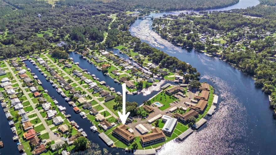 St. Johns River.. Private dock, boat slip, covered boat lift, low insurance costs, on-site fish cleaning station, completely renovated and a motivated seller make this a rare St. Johns River opportunity. Welcome to Jungle Den, a peaceful riverfront community featuring scenic walkways, a community pool, clubhouse, shared fishing pier, and beautifully maintained grounds. Located just minutes from the Blue Creek boat ramp and 30 to 45 minutes from the beaches of Daytona, Ormond, and New Smyrna, this location offers an ideal blend of nature, recreation, and convenience. This fully updated second floor 2 bedroom, 1 bathroom condo includes exclusive use of a private boat slip with covered lift boat parking, perfect for boating to waterfront restaurants, fishing, or enjoying a day trip to Silver Glen. Inside, the condo features luxury vinyl flooring throughout, a renovated kitchen and bathroom, updated bedrooms, and major upgrades including a BRAND NEW HVAC SYSTEM, NEW ENERGY EFFIECENT SLIDER DOOR. Enjoy a quiet, serene setting surrounded by wildlife and river views throughout the community. HOA covers exterior maintenance and major components, with owners responsible only for personal contents, helping keep insurance costs low. HOA allows rentals 30 day min, offering flexibility for personal use or income potential.