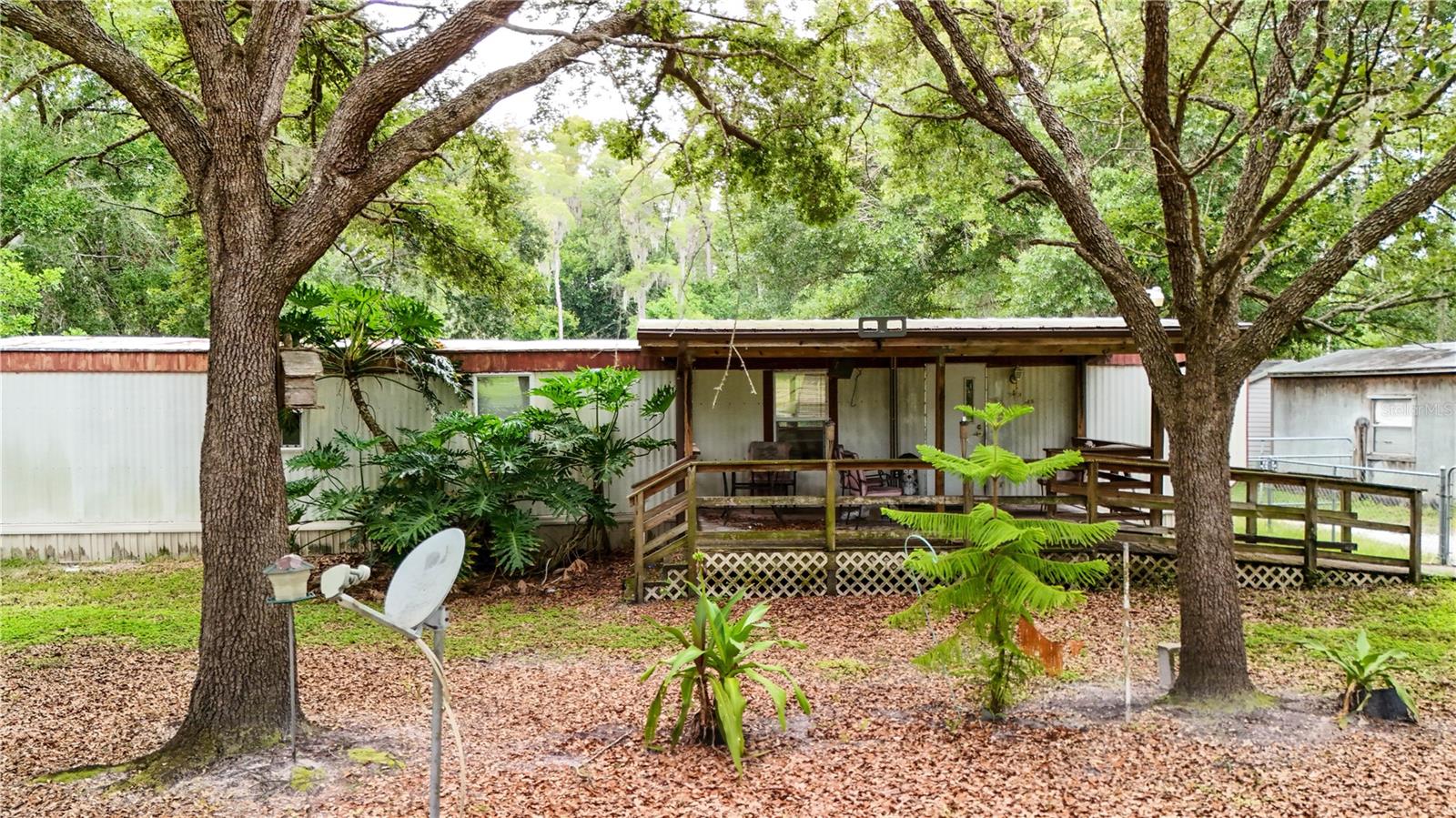 Welcome to your future homesite! This 2.29-acre parcel offers the perfect blend of open space and rural charm. Zoned for agricultural use, the land is partially cleared and fenced, providing privacy and versatility for a wide range of uses—from building your dream home to creating a small hobby farm or garden retreat. Included with the land is a 1982 manufactured home featuring two bedrooms and one bath. It needs some TLC, so you can choose to renovate or remove it. Even better, this lot comes with electric, water and septic utilities already hooked up, saving you time, effort, and money during the building process. With ample space and a flexible layout, you can design the property exactly to your vision. Enjoy peaceful country living with the convenience of being just a short drive from local amenities. This ready-to-build property is a rare opportunity to own a slice of the countryside with essential infrastructure already in place.