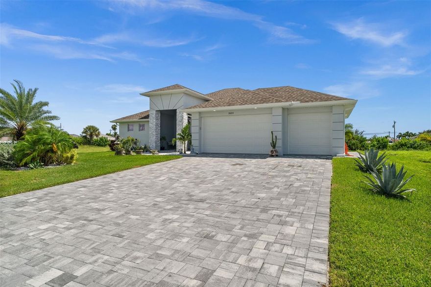 Welcome to this stunning Gulf Access home, completed in 2023 and designed with modern luxury in mind. Offering 3 bedrooms plus an office and 3 full bathrooms across 2,192 sq. ft. of living space, this house combines style, comfort, and functionality. Inside, you’ll find soaring 10-foot ceilings with elegant tray accents, 8-foot doors, and expansive 4’x4’ tile flooring throughout. The kitchen features quartz countertops, a custom tile backsplash, stainless steel appliances, and soft-close cabinetry. Every bedroom features a walk-in closet, while the master suite has a huge glass and tile wet room with three shower heads, dual sinks, and custom cabinetry. Impact-resistant doors and windows bring peace of mind, and the oversized 3-car garage provides ample space. Outdoors, enjoy a large covered lanai with a full outdoor kitchen and a full bath, perfect for entertaining. A brand-new seawall secures the Gulf access canal frontage, ready for your future dock and boat lift. Additional highlights include stained glass French entry doors with transom window, a paver driveway, and a laundry room with sink. Ideally located in one of Cape Coral’s prime neighborhoods, this home is close to restaurants, shopping, and all the best of Southwest Florida living. This property is perfect if you are looking for a newer home, without waiting 2 years for new construction!