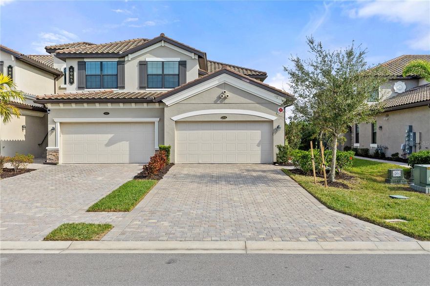 Unlock the door to luxury living in this exquisite coach home, meticulously upgraded and nestled within Lakewood National Golf Club community. Here, contemporary comfort meets timeless elegance, delivering a lifestyle that is both refined and rejuvenating. 
Upon entering, you are greeted by a striking shiplap accent wall that creates a warm and inviting ambiance. The chef’s kitchen is truly a culinary masterpiece, boasting cutting-edge upgrades, including a brand-new refrigerator, oven (2024), and stove (2024), all set against a chic backsplash. Enjoy the peace of mind that comes with a premium water filtration system servicing the entire home, exemplifying thoughtful, modern living. Retreat to the serene primary suite, your personal sanctuary, featuring an automatic shade for effortless privacy and a custom ceiling fan to create the perfect atmosphere. Experience a spa-like oasis in the ensuite bathroom, complete with a sleek corner glass shower adorned with contemporary finishes. Your guests will feel pampered in the elegantly tiled guest bathroom, making every visit a pleasure. Step outside to the expansive lanai, where captivating views of Lakewood National unfold before you. Overlooking the 13th hole of the golf course, this tranquil outdoor space is perfect for relaxation or entertaining, enhanced by custom tile flooring and hurricane shades that ensure comfort throughout the day. As a proud resident of Lakewood National Golf & Country Club, you gain exclusive access to a truly extraordinary resort lifestyle. Imagine enjoying 36 holes of championship golf designed by the legendary Arnold Palmer, alongside tennis courts, a state-of-the-art fitness center, a luxurious clubhouse pool, eight additional satellite pools, pickleball courts, a rejuvenating full-service spa, exquisite dining experiences, and a dedicated lifestyle director to elevate your community engagement. This remarkable home is not just a residence; it's an invitation to embrace a lifestyle of unparalleled luxury and comfort. Could this be your perfect match? Don’t miss out—schedule your showing today!