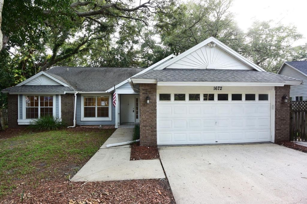 Photo of 1672 Countrywood Street, Tarpon Springs, FL 34689 (MLS # W7886211)