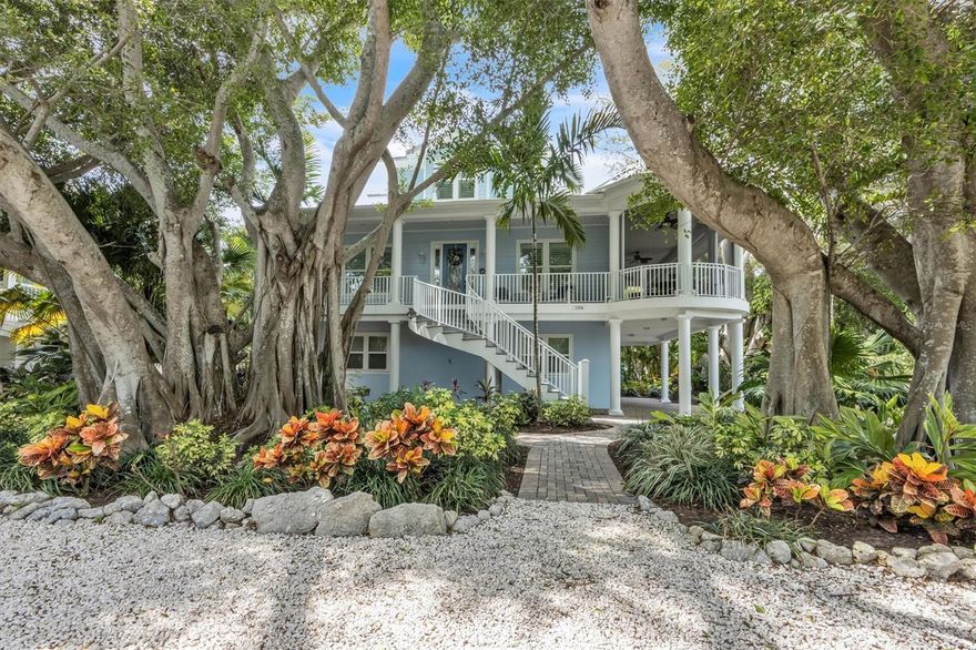 Located WEST of Gulf Drive and ONLY 2 homes from the Gulf of Mexico beaches!!!!  This 5 bedroom, 3.5 bathroom home is located on one of the most beautiful streets on Anna Maria island.  What makes the home even more unique is 3 spectacular banyan trees that provide gorgeous street appeal and all-day shade, keeps the house cool with no blaring afternoon sun.  If you are interested in more bedrooms, it could be easily be transformed into a 6 bed room 5 full bath home with more than 3600 square feet.   The home sits among 10 million to more than 20-million-dollar homes and is steps from the Gulf of Mexico.  Climb the grand staircase to the main living floor and enter the dining room, great room, and gourmet kitchen area. This home offers an open floor plan with built-ins, a gas fireplace, and an underground gas tank. Pocket sliders that open up to a 20X40 foot screened in porch with Trex flooring, perfect for afternoon cocktails with a gulf breeze!   All windows, sliders, and doors are impact hurricane-rated.  A private office, half bath, and second master ensuite with a third full bath shared by a family suite also on the main living floor.  An elevator, home security system, crown molding throughout, outdoor lighting and beautiful wood floors are more fabulous features. The master bedroom, bath, and closet along with the 5th bedroom, presently used as a second office, create a huge private master suite on the entire top floor. The master closet is as big as a bedroom, as is the master bath! This home was built by Whitehead & Bruce Williams, everything very well thought out and much attention to detail!   Walk right out your door, past 2 houses to the sugar sand beaches of world-famous Anna Maria Island. Enjoy watching dolphins, manatees, and gorgeous sunsets with unobstructed sweeping panoramic Gulf views, swim, kayak, paddle board, and float in the warm, clear turquoise waters of the Gulf of Mexico. Walking distance to restaurants and all that Pine Avenue has to offer.  Create a lifetime of memories. Don’t wait, come live the dream! Public boat ramps, parks, tennis and basketball courts, a dog park, and a skate park are all available on the Island. There are fitness centers & a "members only" 9-hole Golf Course available. And of course, the 7 miles of AMI BEACHES! Banyan tree shade keeps electric bills very reasonable, even in the summer. An oversized garage to store all your toys for the beach with room for the golf cart as well as your cars. An idea suggested for the large room ground level is to create a workout room on the ground level. A well is on this property currently shared by the rear neighbor, each owns their own pump which serves the irrigation needs. If you want a bigger home, adding a 6th bedroom and 5th full bathroom, please see 2 drawings of proposed changes in attachments. Make your Island dreams a reality and schedule your private showing today.