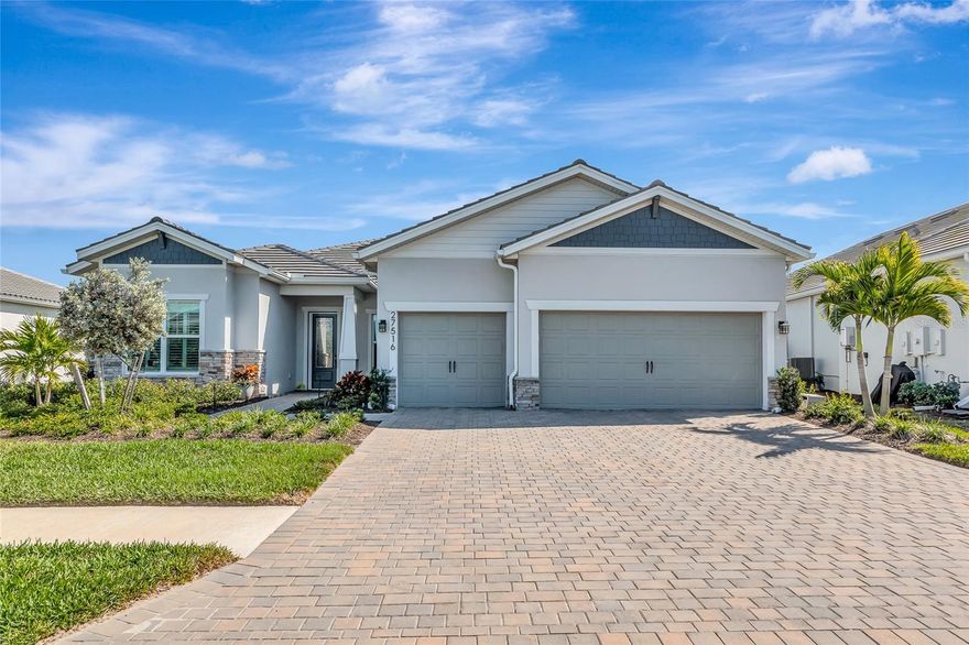 Welcome to this beautifully designed Stellar floor plan located ON THE WATER in the highly sought-after Beachwalk by Manasota Key community. ONLY 2.5 MILES TO THE BEACH. The exterior stone masonry, glass insert door & LED lighting give this home an inviting curb appeal. Plus the extra space on each side of the home adds to the allure. This home offers a bright, open concept layout that perfectly captures the Florida lifestyle, with seamless flow between living, dining, and kitchen spaces, ideal for both everyday living and entertaining. The kitchen is thoughtfully designed with ample cabinetry, generous counter space, GAS COOKING, and modern finishes, overlooking the main living area to keep everyone connected. WATER FILTRATION SYSTEM. Natural light fills the home. Decorative ceiling wood beams, accent wall & 8 FOOT DOORS adds to the elegance of this home. The spacious primary suite serves as a private retreat, complete with a well-appointed bathroom, walk-in shower, double sinks and large walk-in closet. Additional bedrooms provide flexibility for guests, a home office, or family, while the overall layout balances openness with privacy. Step thru the ZERO CORNER DOORS and enjoy indoor/outdoor living on the EXTENDED LANAI WITH IN-GROUND HEATED BY SOLAR SALT WATER POOL WITH DECK JETS WATER FEATURE, perfect for relaxing afternoons or evening gatherings. Whether you’re enjoying quiet mornings, swimming or hosting friends, this home is designed to make the most of Florida’s year-round sunshine. 3 CAR GARAGE WITH 4FT EXTENSION. IMPACT GLASS WINDOWS/DOORS. Enjoy a resort style lifestyle which includes the ON SITE HIGH TIDE TIKI BAR, the Waterline upscale restaurant (opening in 2026), 21 sports courts for pickleball, tennis, and bocce ball, a resort style pool with beach entry and attached lap pool, amenities center, Cafe', fitness center, boardwalk, Veterans memorial park, community garden, dog park, and miles of trails. The full time activity directors ensure a vibrant and engaging social calendar. Conveniently located near some of Florida’s most beautiful beaches, boating, exceptional dining, shopping, schools, and endless outdoor recreation. This home offers the perfect blend of luxury, comfort, low maintenance and location, so don't miss your opportunity to live in Paradise.