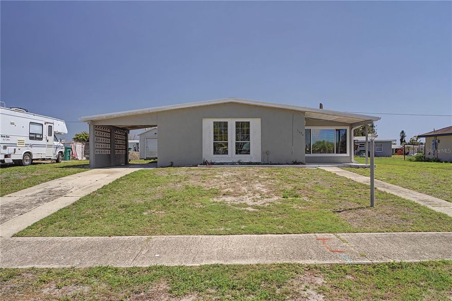 HOME IN PORT CHARLOTTE W/NEW ROOF - Move-in ready, 2 bed/1 bath home in Port Charlotte has nice sized rooms, fresh interior paint, tile flooring throughout & lots of natural light thanks to large, picture windows. Interior layout includes an open-concept living/dining area, a Florida room that extends the living space plus a screened lanai. The kitchen has wood cabinetry and NEW STAINLESS-STEEL APPLIANCES. Additional features include a carport, exterior-access laundry room, shed (2021) and no deed restrictions or HOA — giving you the freedom to use the property as you choose. Close to all area amenities including Sunseeker Resort, Charlotte Sports Park (home of Spring Training for the Tampa Bay Rays) as well as downtown historic Punta Gorda and North Port. If you’re looking for character, privacy, and a prime Port Charlotte location close to everything, this home is ready for its next chapter. Make an appointment today.