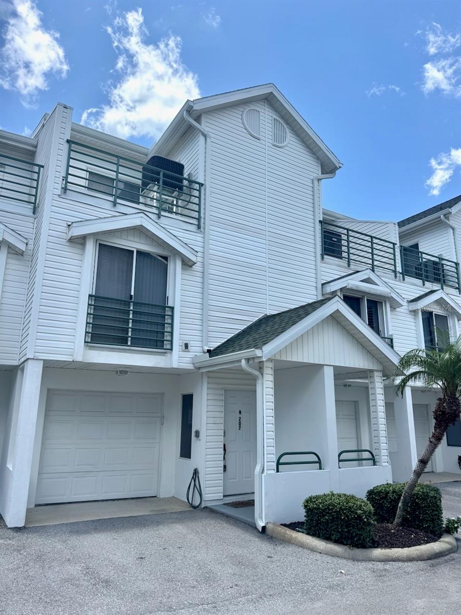 THE ONLY TOWN HOME for rent on Island Way!!!SO MUCH PRIVACY!!! A 3-story 1700 sq. ft. beach townhouse with a loft, offering a rare opportunity for spacious beach living with 3 bedrooms and 3 full bathrooms and a 2 car oversized tandem garage and three amazing balconies. Located in the desirable Island Estates community, this home is ideally situated with walking distance to Publix, UPS and Island Way Grill. You can even take the trolley to the beach!!!! The ground floor features a tandem oversize garage, providing ample storage for beach toys and more. A patio at the back of the garage offers a perfect spot for grilling. On the second floor, you'll find the kitchen, dining room, and living room combination with a large second floor balcony, along with a spacious bathroom and a guest bedroom. On the Third floor, discover two generously sized bedrooms, each with its own full bathroom for privacy and comfort. The main bedroom includes an additional bonus loft, expanding the living space uniquely. Plenty of storage space with walk in closets and extra storage in the loft. Residents can enjoy leisurely days at one of the area's finest community pools, featuring expansive pool areas with cabanas, a barbecue area, and a spacious spa. With great restaurants nearby and the World famous Clearwater Beach just a short distance away, this location offers the best of coastal living. Cable, Interne, garbage and lawn care included in rent. 1st, last and security required!!