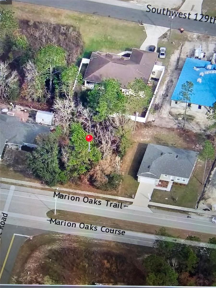 Large community part of the Ocala metropolitian area. Community with Public Library, community playground 4.3 miles from lot; about a 15 min drive  (10 mi) to Marion Oaks Shopping Center, Winn-Dixie, and Camview Plaza. Lot big enough to build a 1800-2500 SqFt one story home a 3/2 or smaller 4/2. Dobule that if you build a 2 story home.  Variety of builders to build new. ***NO CDD NO HOA.****