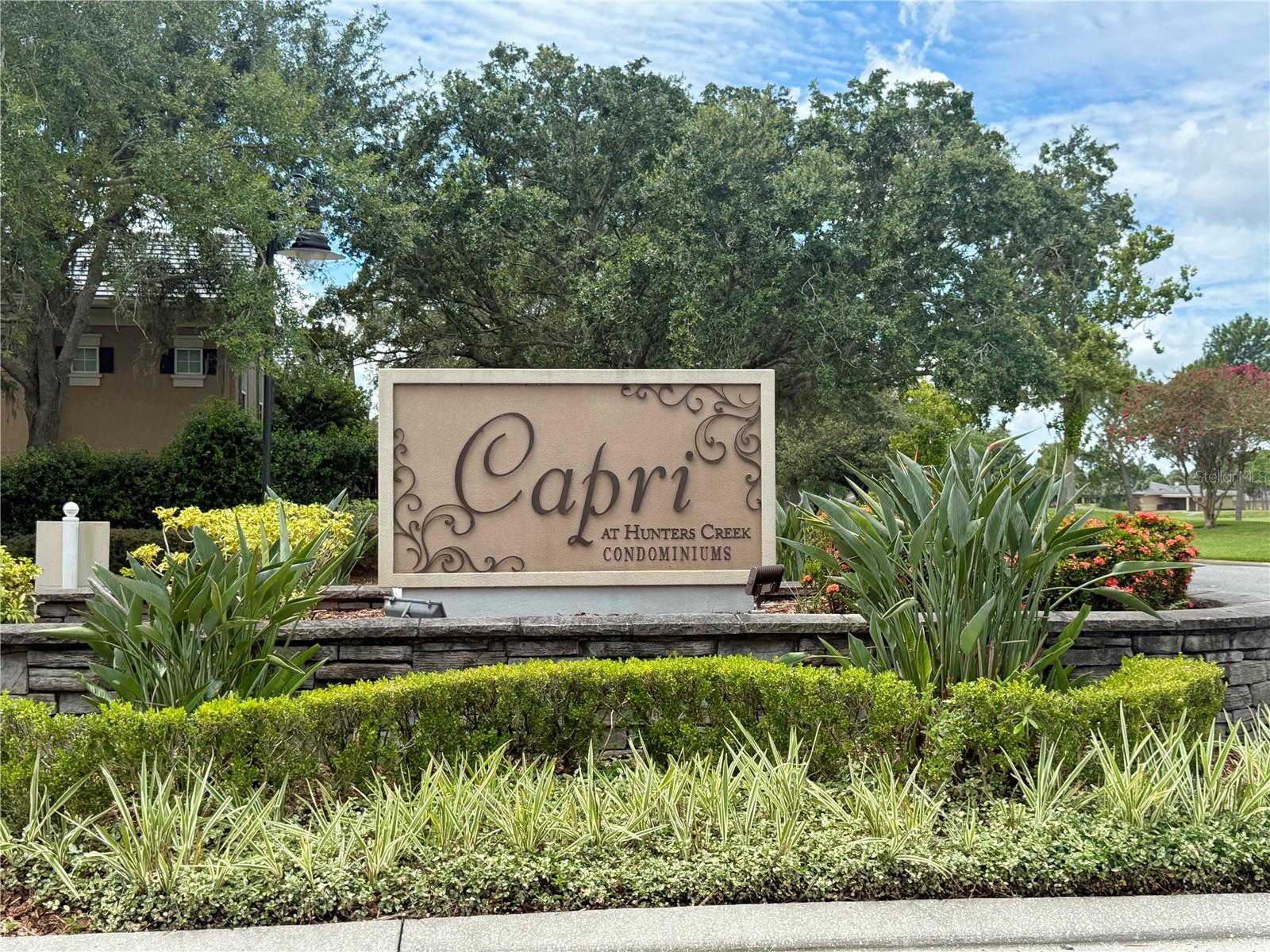 Great Location in Capri at Hunter's Creek! 2nd floor. This property has been freshly renovated! Features: Fresh coat of Paint throughout, NEW Luxury Vinyl Floors, New granite counter tops, new appliances, New A/C unit, New Water heater, Dining space and separate Living area, Walk in Closet, ceiling fans, indoor laundry with washer and dryer, Porch with additional storage room. Gated community includes pool, fitness center, BBQ Grills, Beach Volleyball, and a Club house. Close to shopping, restaurants, theme parks, airport, all major roads, A rated schools and more! WATER is included in the rent!