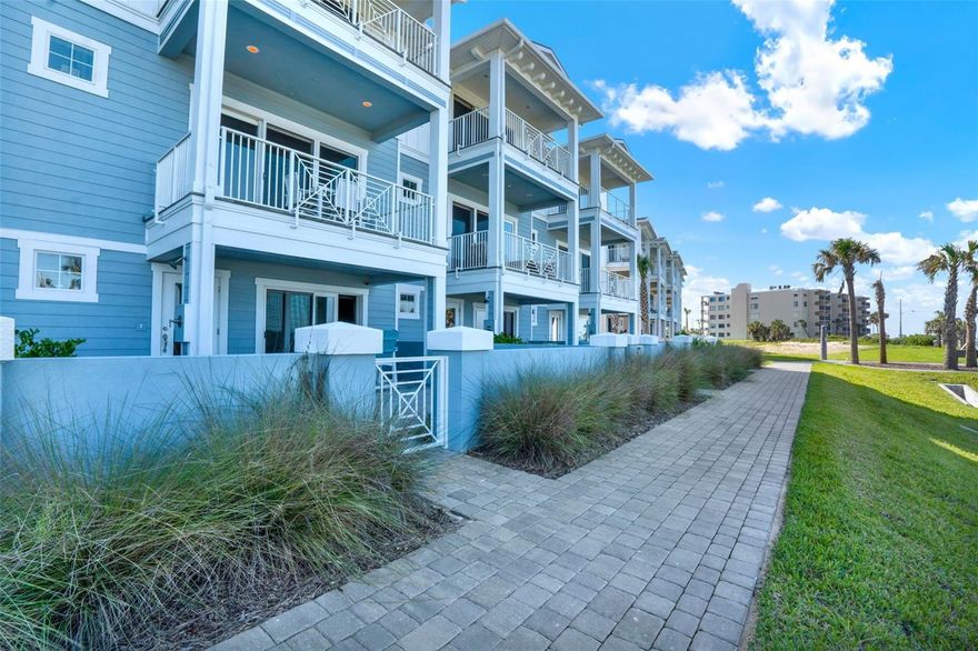 Price Adjustment. Introducing Oceanview Luxury Townhomes in the exclusive Verona Oceanside community, just steps from the serene, traffic-free sands of Ormond Beach. Offering over 2,276 square feet of premium coastal living, this three-story private residence is thoughtfully designed for those who crave effortless beachside luxury with breathtaking ocean views and private beach access. Enter through a charming paver courtyard and covered lanai, setting the tone for relaxed sophistication. The first floor welcomes you with a spacious flex area—ideal as a secondary living space or guest retreat —and a convenient half bath. From there, ride your private ELEVATOR to the second level, where an open-concept layout unfolds to reveal a gourmet kitchen complete with a grand island, 42" wood cabinetry, granite countertops, stainless steel appliances, and a walk-in pantry. The adjoining living and dining area flows seamlessly onto a covered balcony, perfect for soaking in the sea breeze and ocean views. The third floor hosts the private quarters, including a luxurious ocean-facing master suite featuring a walk-in closet, dual vanity en-suite with a tiled walk-in shower, and a private balcony—the perfect spot to unwind to the sound of crashing waves. A spacious secondary bedroom includes its own private bath and walk-in closet, with a full laundry room conveniently located nearby. This maintenance-free home also includes a 3 bedroom / 3.5 bathrooms, 2-car garage, high-impact windows and sliders, and is covered by a 2-10 Home Warranty. Future amenities include a community pool, and rental restrictions preserve the peaceful, residential atmosphere. Don't miss your chance to own in Ormond Beach's newest, most coveted oceanfront community—Verona Oceanside. All furniture is negotiable in the sale; however, personal items, accessories, trinkets, and bronze statues do not convey with the sale. Florida lifestyle just steps from the sand!