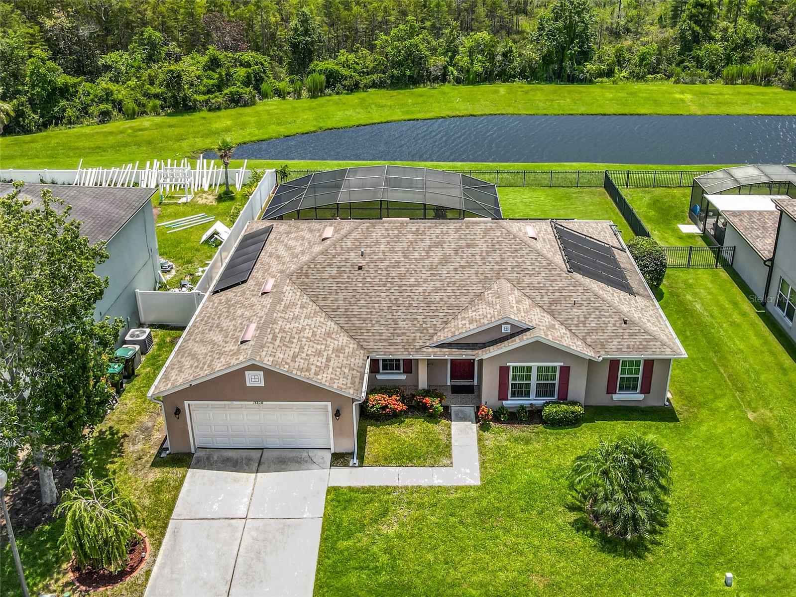 Beautiful Conservation, Water, Sunrise, & Wildlife Views. Even an occasional Rocket Launch View. No rear neighbors. Move in ready, unfurnished, 4/2 Pool Home located in the Gated Community of Eagles Hammock in Waterford Chase East. All Tile Floors, Roof replaced 2019, Quartz Kitchen Counters, Quartz Master Bath Counters, Stainless Appliances, Freshly Painted Inside, Gutters, New Garage Door Opener installed 2022, Hybrid Hot Water Tank installed 2021, Pool Pump replaced 2021, New Pool Filter Housing, Solar Pool Heat installed 2021, Energy Efficient Thermal Double Pain Windows installed 2021, Lanai Screens replaced 2022, Fenced Backyard, Custom Blinds. Equipped with Solar Panels, saving you hundreds on your electric bill each month. Solar Panels installed 2021, to be paid off by seller at closing. Camera surveillance security system that stays with the home. This beautiful conservation view of the pond, sunrises, & wildlife makes it a great place to relax, swim and entertain friends and family. All amenities include parks, play grounds, tennis courts and basket ball courts. Just minutes away from Waterford Lakes Town Center offering more than a 100 specialty shops, a variety of restaurants and entertainment in a park like setting. Close to UCF, Valencia and Research Parkway. Central Florida is close to beaches, airports, attractions and more. Call and schedule your showing appointment today!