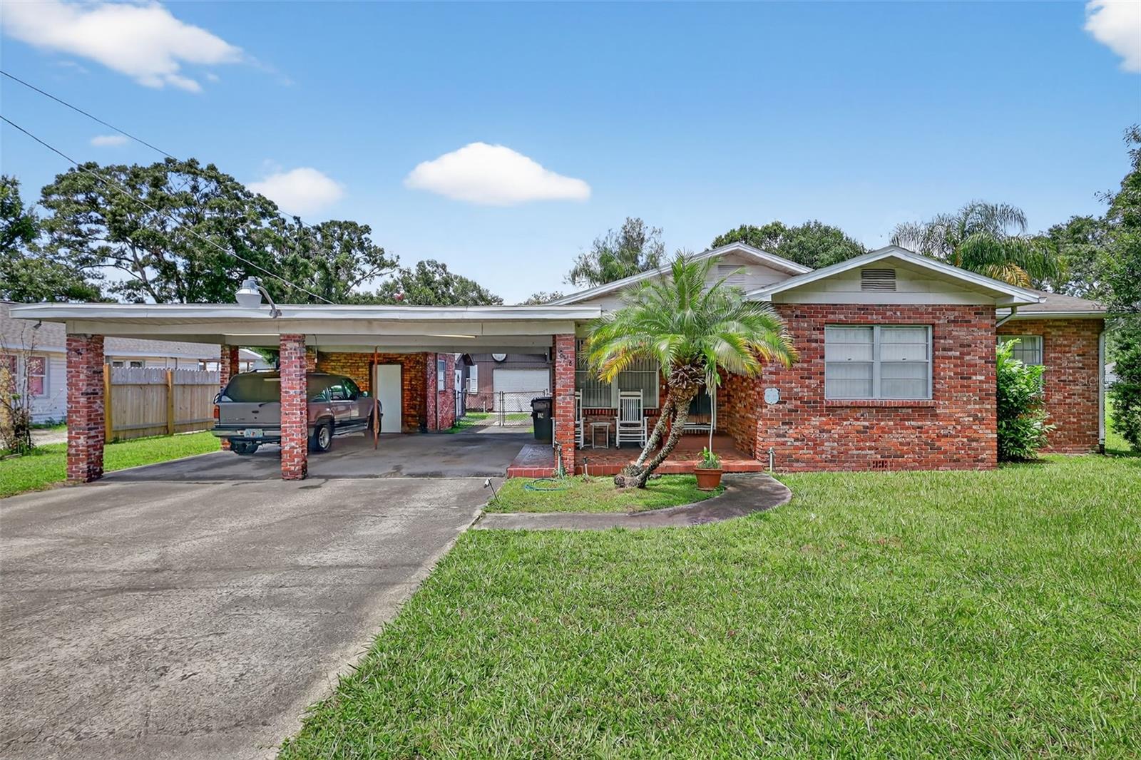 HARD TO FIND - 1,472SF THREE BEDROOM TWO AND A HALF BATH BRICK OVER FRAME HOME PLUS 1,400SF WORKSHOP WITH FULL BATH PLUS INGROUND POOL ON ALMOST 1/2 ACRE! HOME FEATURES FAMILY ROOM WITH BRICK FIREPLACE PLUS LIVING/DINING ROOM, LARGER KITCHEN WITH PANTRY, INSIDE LAUNDRY ROOM WITH 1/2 BATH. PRIMARY BEDROOM WITH FULL BATH. FORMER CABINETRY WORKSHOP HAS 3 SECTIONS PLUS OFFICE, BATHROOM AND HARDWARE ROOM. HUGE INGROUND POOL WITH PRIVACY FENCING HAS ALWAYS BEEN MAINTAINED. LOTS OF FENCED OPEN YARD FOR PETS AND PLAY. ONLY 10 MINUTES FROM DOWNTOWN, 10 MINUTES TO BRANDON - GREAT ACCESS TO SELMON EXPRESSWAY, I-4 AND I-75. HOME NEEDS SUBFLOOR/PIER STRUCTURAL WORK (IN 2020 OWNER HAD CONTRACTED FOR ALL REPAIR FOR $30K BUT WASN'T DONE), TENTING FOR TERMITES AND UPDATING. ROOF IN CARPORT LEAKING. NEEDS SIDING REPAIR AND ROOFING ON WORKSHOP.