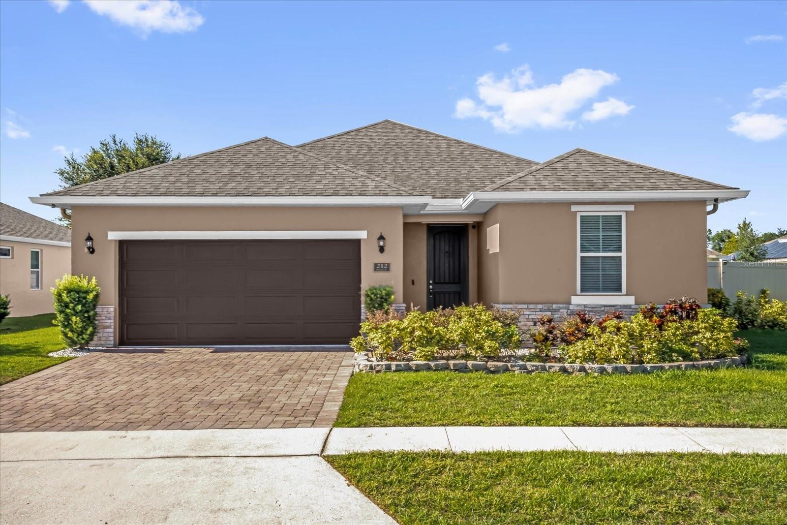 This single-story home in Venezia South features 3 bedrooms, 2 bathrooms, designed with an open, bright, and spacious layout that blends comfort with functionality. The modern kitchen is a chef’s delight, showcasing oven, white cabinetry, granite countertops, stainless steel appliances, an island bar, and pendant lighting, and it flows into the dining area with sliding doors that lead to a large, fully fenced beautifully landscaped backyard—perfect for entertaining and outdoor fun. The dining space also connects to the central living room, creating a warm and inviting hub for everyday living. Additional conveniences include a Blink camera security system, inside laundry room and ample garage space. Nestled in Howey-in-the-Hills, a Chain-of-Lakes community situated between Clermont and Mount Dora, residents can enjoy nearby parks abd playgrounds With close proximity to the Turnpike, the home offers an easy commute to Orlando, the airport, Disney World, and Universal, all within about 40 minutes. Come see it today!