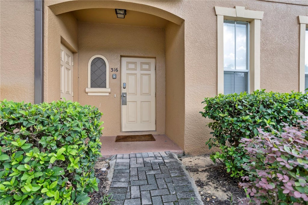 Photo of 316 Cambria Avenue, Davenport, FL 33897 (MLS # O6438673)