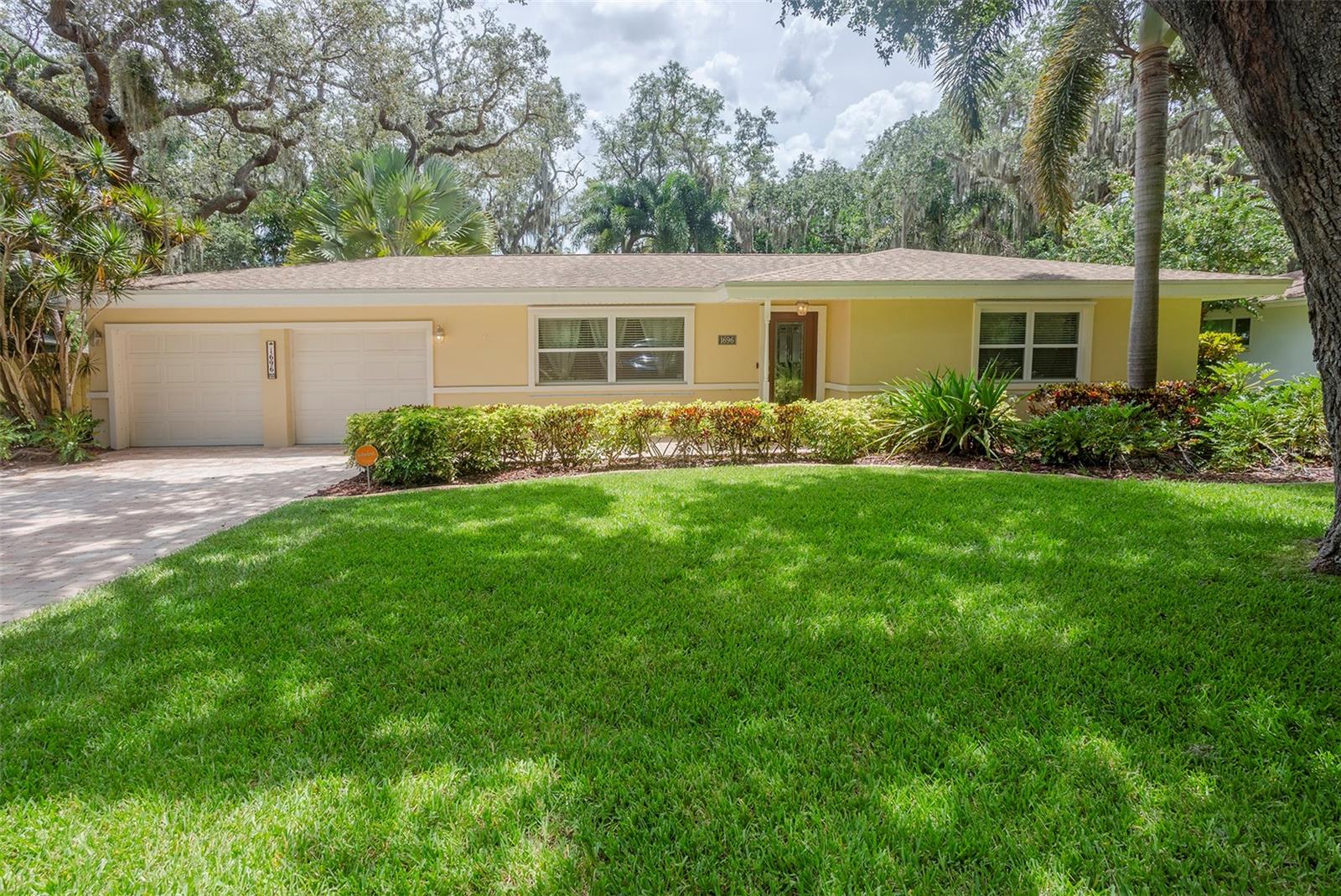 Nestled on a tranquil street in Largo, this 2-bedroom, 2-bath residence offers 1,286 square feet of thoughtfully designed living space. Natural light filters through large windows, illuminating an open-concept living and dining area that creates an inviting atmosphere for both daily living and effortless entertaining. At the heart of the home, the kitchen provides ample space for preparation, gathering, and conversation, making it as functional as it is welcoming. The primary suite serves as a private retreat, while the second bedroom offers versatility ideal for guests, a home office, or a creative space. Two full bathrooms ensure convenience and ease for everyday routines. The home opens to an inviting outdoor living area, perfectly suited for alfresco dining, weekend gardening, or quiet evenings under the palms. Whether accented by string lights or shaded by a hammock, this space is designed for relaxation and connection. Adding to its appeal, this property is currently income-producing, offering buyers the opportunity to enjoy both personal use and financial return. Whether used as a primary residence, seasonal getaway, or continued rental investment, it presents exceptional versatility. The location further enhances its value, with award-winning Gulf beaches, the Belleair Causeway, Largo Central Park, and a variety of local cafés and shops just moments away. It offers the rare balance of peaceful residential living with easy access to the best of Florida's Gulf Coast lifestyle.