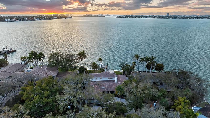 First time available in 40 years! "Tween Bridges" is a rare bayfront  property located in highly sought-after Cherokee Park, West of Trail. This 4-bedroom,3.5 bath residence offers unobstructed panoramic views of Sarasota Bay.  The breathtaking sunsets and stunning vistas of Ringling Bridge, Siesta Key and downtown are truly mesmerizing. Boating enthusiasts will appreciate the brand-new dock with a 16,000lb lift and direct access to Sarasota's exceptional boating waters.  Enjoy the home as it is or take advantage of this rare opportunity to build a custom waterfront estate on this magnificent property.  Offered at $6,990,000, do not miss your chance to own one of Sarasota's finest waterfront locations. "Tween Bridges" is named for its location between The Ringling Bridge and The Siesta Key north bridge.