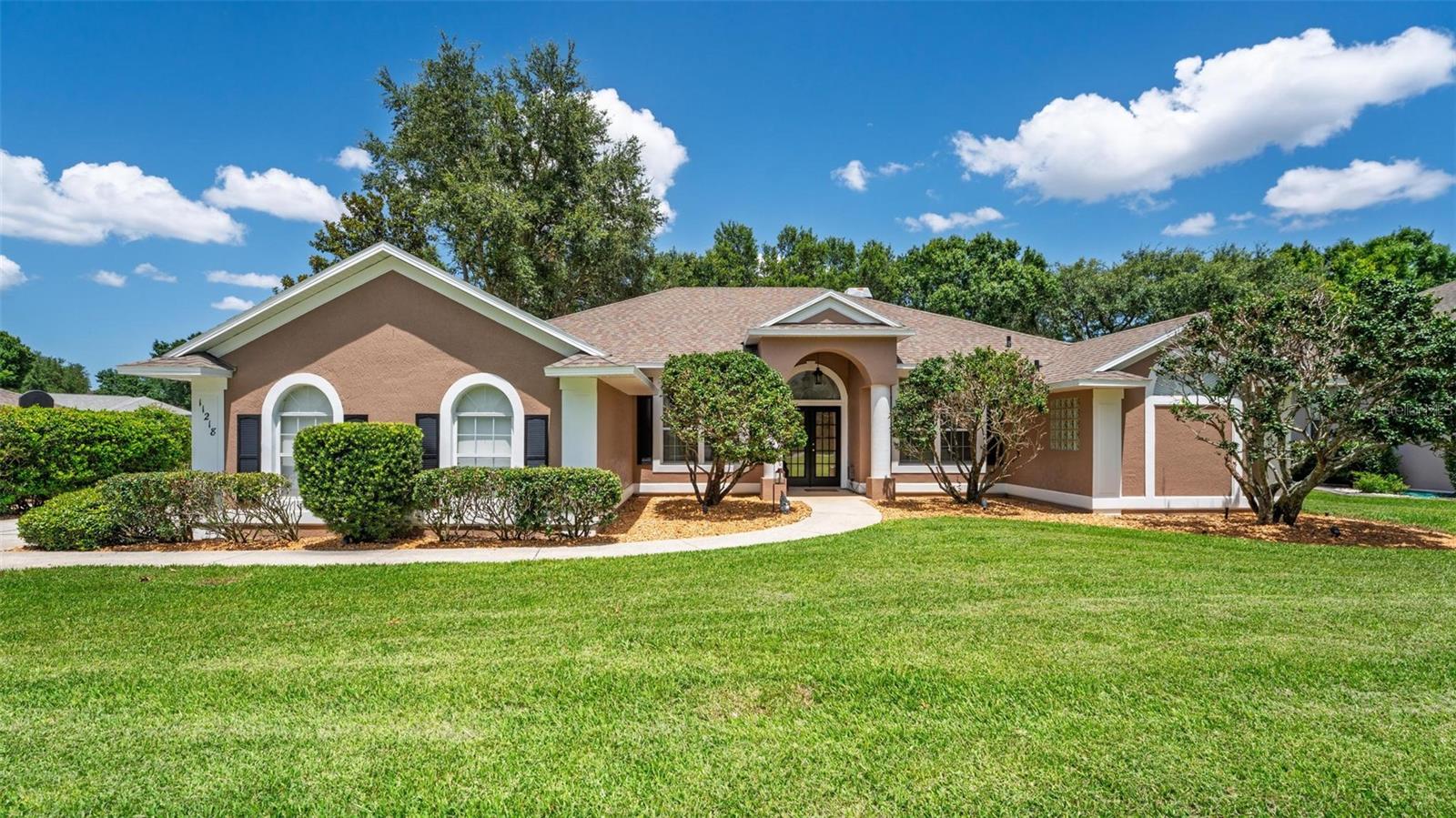 EXPERIENCE THE PERFECT HARMONY OF LUXURY, FUNCTIONALITY, AND NATURAL BEAUTY IN ONE OF CLERMONTS MOST DESIRABLE WATERFRONT COMMUNITIES, IN THIS METICULOUSLY MAINTAINED POOL HOME!! This exquisite 3 bedroom plus den, 2 bath home features an open floor plan & lends itself to casual, yet elegant, living. Step inside to find a stunning family room with a wood burning fireplace, wood flooring, & glass sliding doors leading out to the expansive lanai. The breakfast nook has a huge picture window which allows natural light to pour in, & unobstructed views of the extravagant outdoor space. A truly exceptional kitchen has real wood cabinets, a designer back splash, built-in desk, a stainless-steel cooktop, a walk-in pantry, a breakfast bar, & plenty of storage. The formal dining room has wood flooring and is perfect for entertaining. Retreat to the luxurious master wing that includes a tray ceiling, his & her walk in closets, large glass sliding doors & big windows that allow for extra light. The ensuite is a spa like bath with a jacuzzi tub, custom tile, dual sinks, a walk-in shower, & plenty of storage. Your guest will enjoy their own privacy in one of the well-appointed guest bedrooms with a large bathroom with dual sinks to share. The oversized screened lanai is optimal for outdoor living with a huge pool & spa plus plenty of space for an outdoor summer kitchen all overlooking gentle slopes, with lush landscaping. Susan's Landing is a private-gated waterfront community on "Lake Susan" which is on the Chain of Lakes. There is a private boat dock & ramp for owners to enjoy. This community also has private storage for your boat & RV. You are located close to shopping, restaurants, and a short drive to the popular theme parks in Orlando. Schedule your showing today.