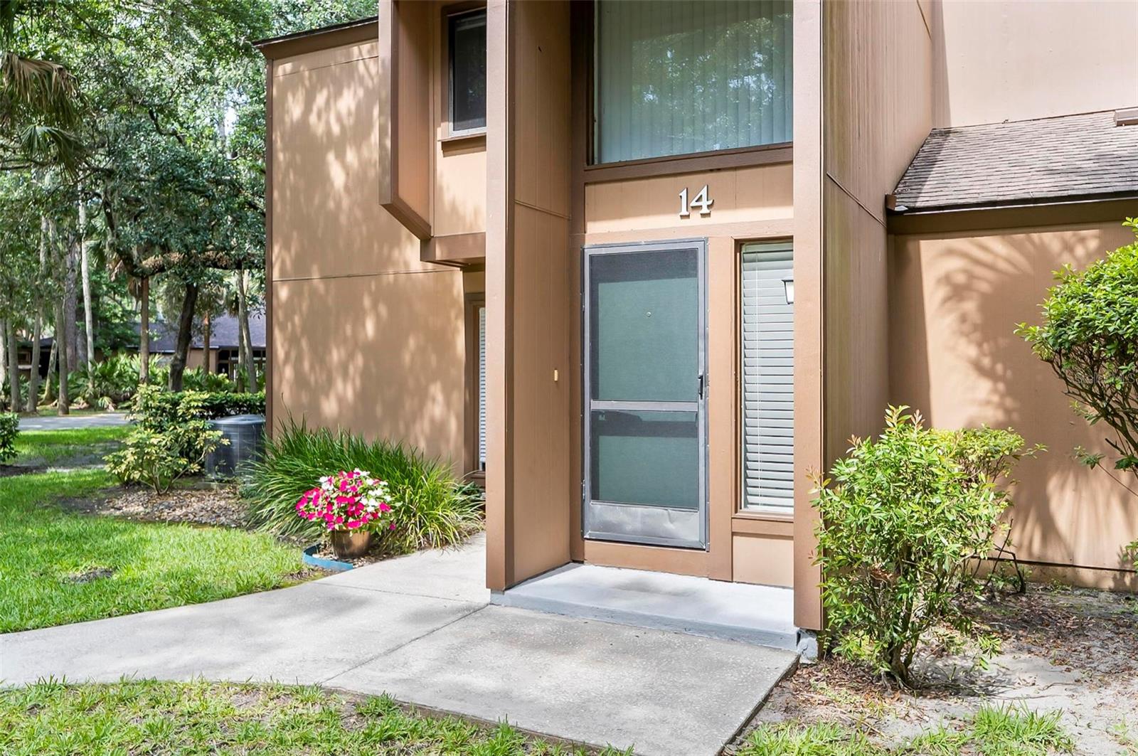 This nicely located second-story 2-bedroom, 2-bath condo has been freshly painted with new carpet and is located in the established Fairways community offers a perfect blend of convenience and tranquility, nestled beneath a breathtaking canopy of majestic oak trees. The spacious primary suite provides privacy and comfort, with direct access to an expansive screened porch, seamlessly connecting indoor and outdoor living. A versatile second bedroom is ideal for guests or a stylish home office, while bright, open living and dining areas create an inviting atmosphere. Residents enjoy the relaxing amenities, including a heated and screened community pool, sauna, clubhouse, game room, library, full kitchen, and tennis courts. Located just minutes from Jungle Hut Beach and the lively European Village, this home places you at the heart of Palm Coast’s best entertainment, shopping, and dining. Don’t miss your chance to own this extraordinary piece of paradise! A/C replaced 2023.